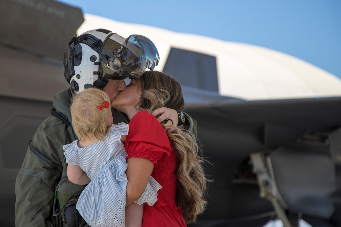 U.S. Marine Corps Capt. Michael Hauer with Marine Fighter Attack Squadron 122 reunites with loved ones after returning from deployment with the 15th Marine Expeditionary Unit (MEU) to Marine Corps Air Station Yuma, Arizona, May 18, 2021.