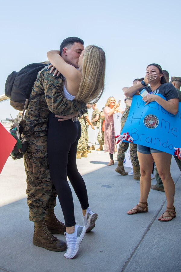 A U.S. Marine with Marine Fighter Attack Squadron 122 reunites with loved ones after returning from deployment with the 15th Marine Expeditionary Unit (MEU) to Marine Corps Air Station Yuma, Arizona, May 18, 2021.