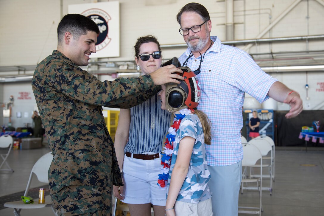 U.S. Marine Corps Cpl. Montana Burke with Marine Fighter Attack Squadron 122 reunites with his family after returning from deployment with the 15th Marine Expeditionary Unit (MEU) to Marine Corps Air Station Yuma, Arizona, May 18, 2021.