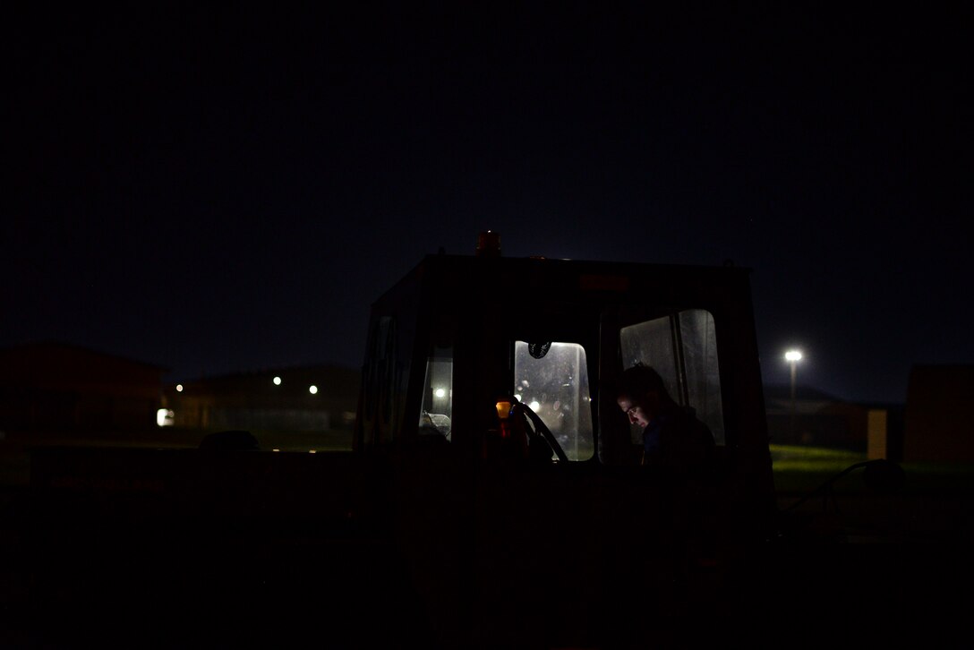 An Airman reads a technical order.