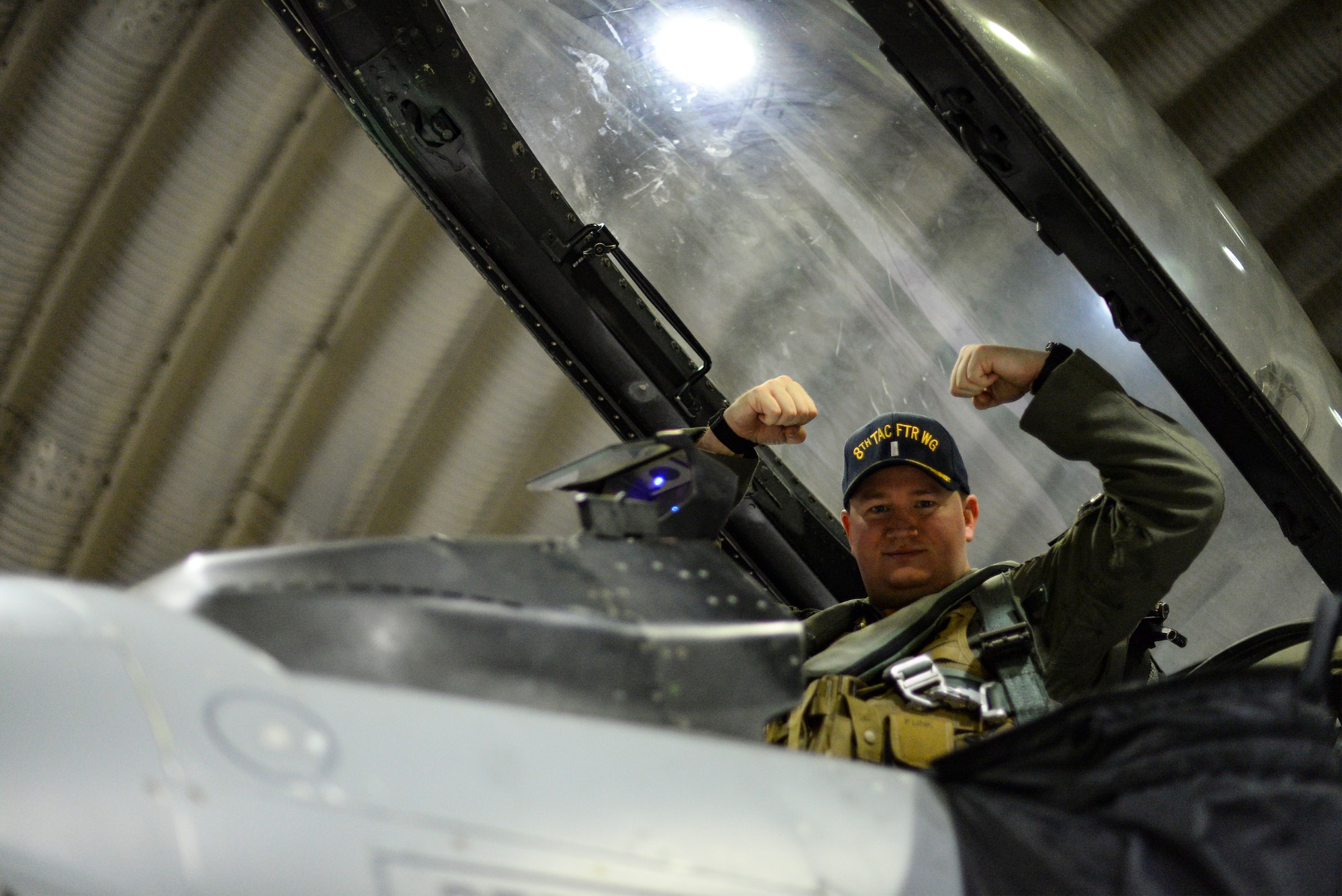 A pilot poses for a photo before flight.