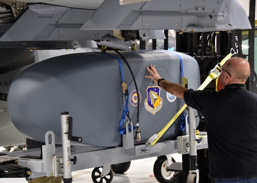 The Air Force Research Laboratory’s AgilePod is shown mounted on the wing of the Textron Aviation Defense’s Scorpion Light Attack/ISR jet. The AgilePod is an Air Force-trademarked, multi-intelligence reconfigurable pod that enables flight-line operators to customize sensor packages based on specific mission needs. A fit check in late December 2017 provided an opportunity to demonstrate the ability of the pod to rapidly integrate onto a new platform with short notice, highlighting the benefits of Sensor Open Systems Architecture.
