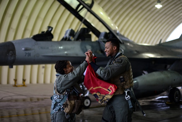 Airmen celebrate after a flight.