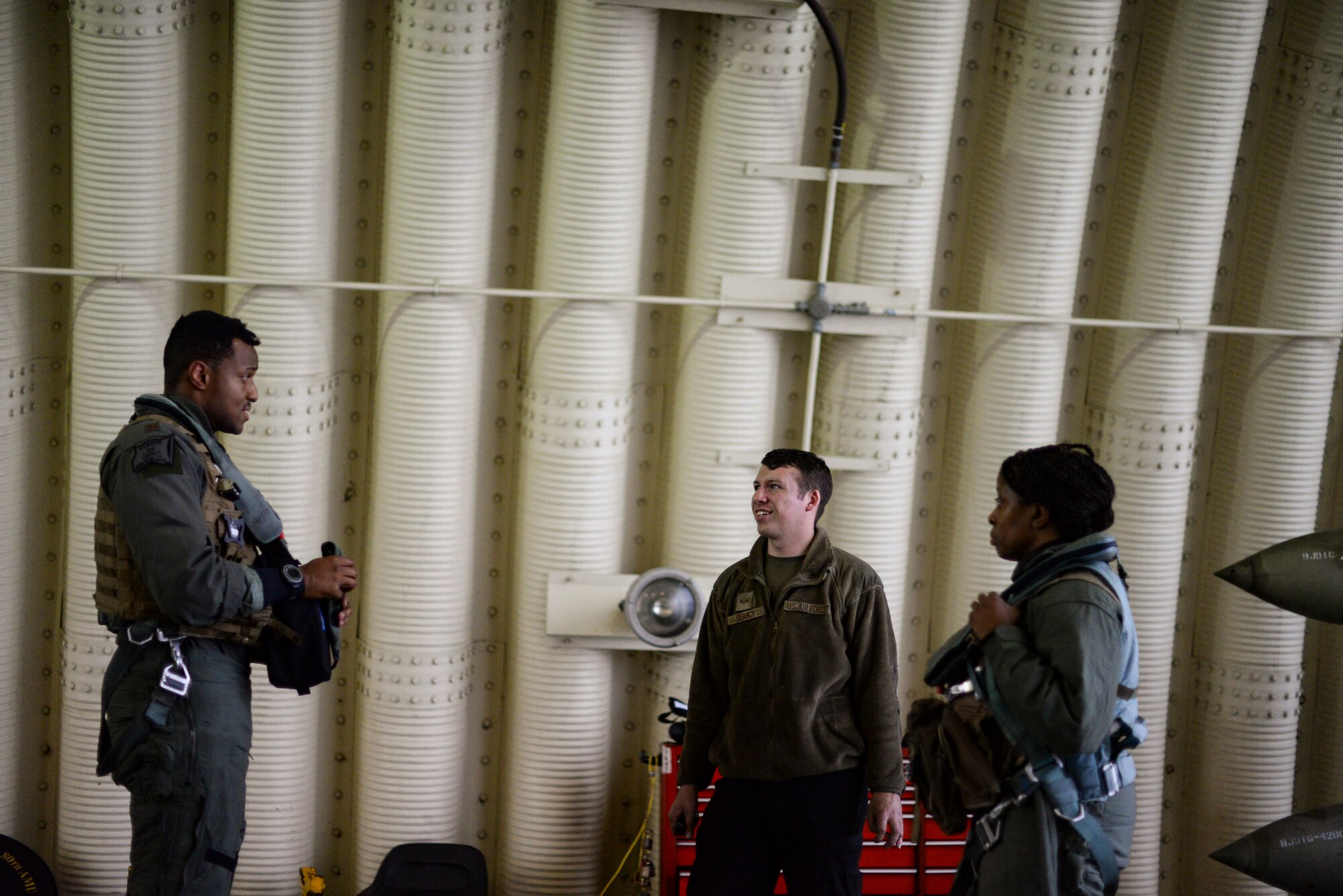 Airmen speak to each other after a flight.