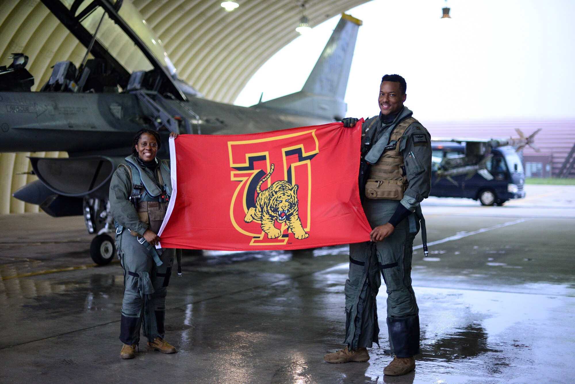 Two Airmen pose for a photo.