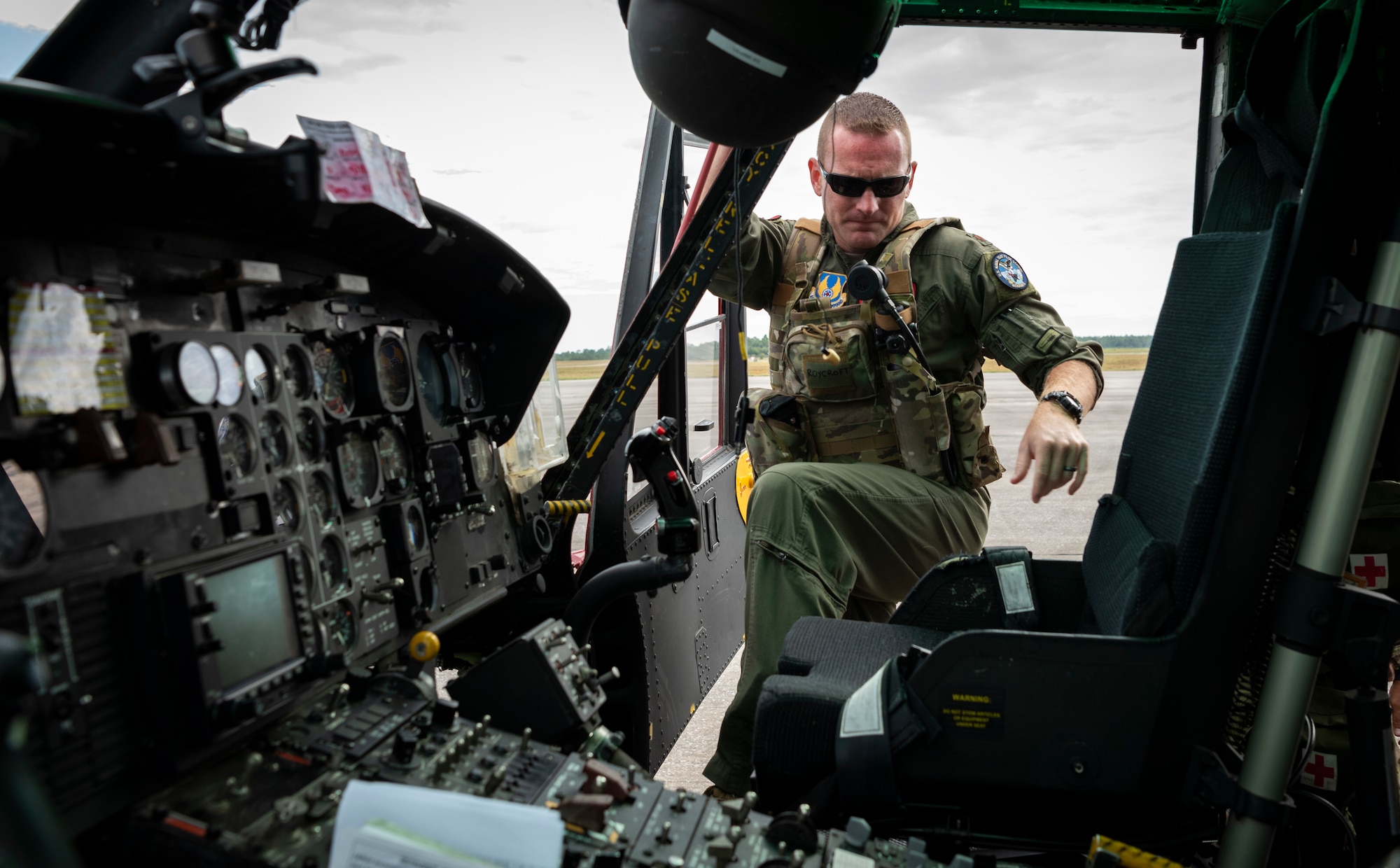 Maj. Zach Roycroft, of the 413th Flight Test Squadron, climbs into the cockpit of a UH-1N helicopter in preparation for a test flight at Duke Field near Eglin Air Force Base, Fla., Sep. 16, 2019. The squadron received its first MH-139 helicopters, which will replace the UH-1N, for flight test in Dec. 2019. (Photo by J.M. Eddins Jr.)