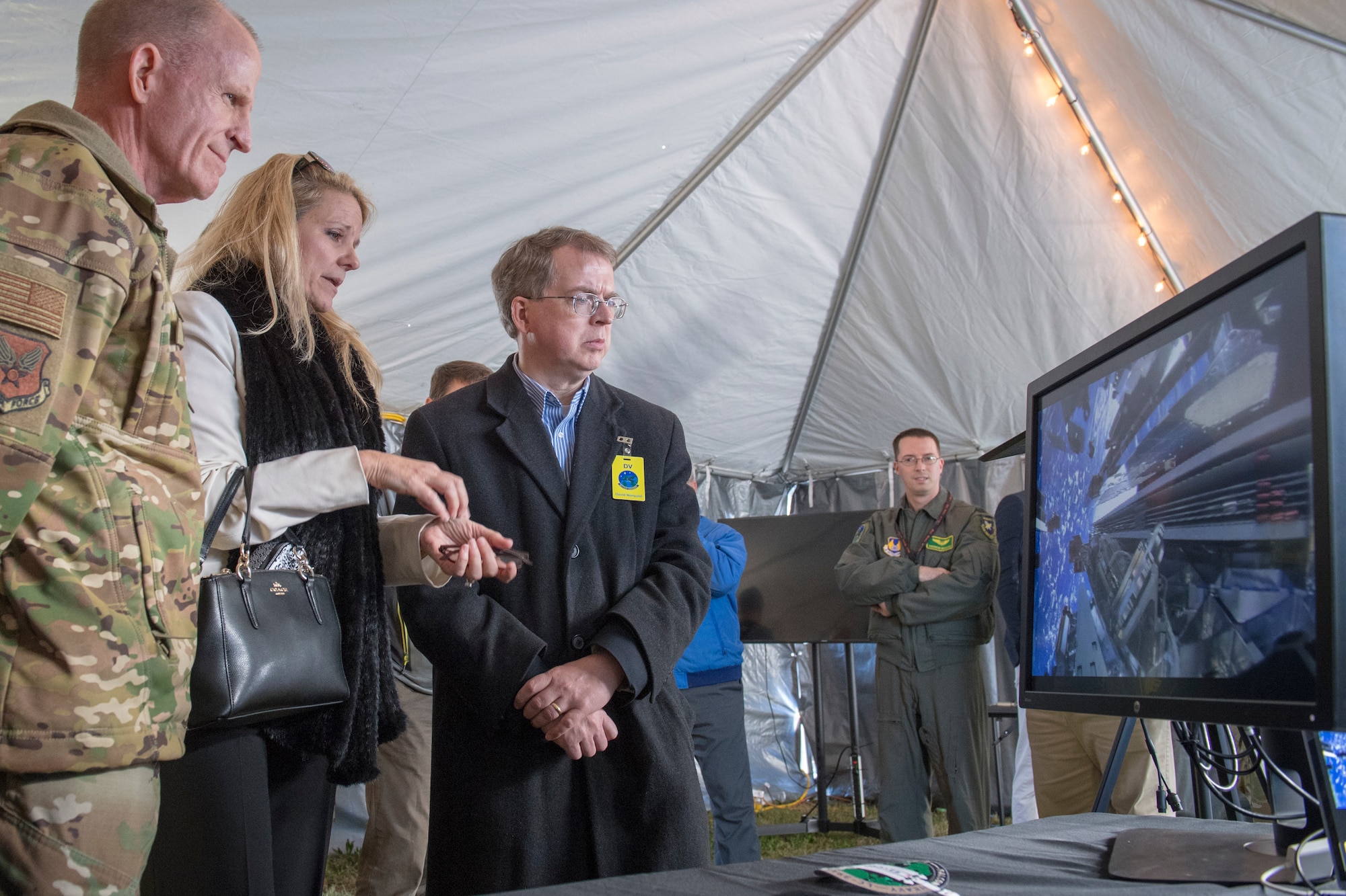 Gwynne Shotwell (center), SpaceX Chief Operating Officer, briefs Gen. Stephen W. Wilson, Vice Chief of Staff of the United States Air Force (left) and David Norquist, Deputy Secretary of Defense, on SpaceX capabilities during the Advanced Battle Management System (ABMS) demonstration at Eglin Air Force Base, Fla., Dec. 18, 2019. During this week’s first demonstration of the ABMS, operators across the Air Force, Army, Navy and industry tested multiple real time data sharing tools and technology in a homeland defense-based scenario enacted by U.S. Northern Command and enabled by Air Force senior leaders. The collection of networked systems and immediately available information is critical to enabling joint service operations across all domains.(U.S. Air Force photo by Tech. Sgt. Joshua J. Garcia)