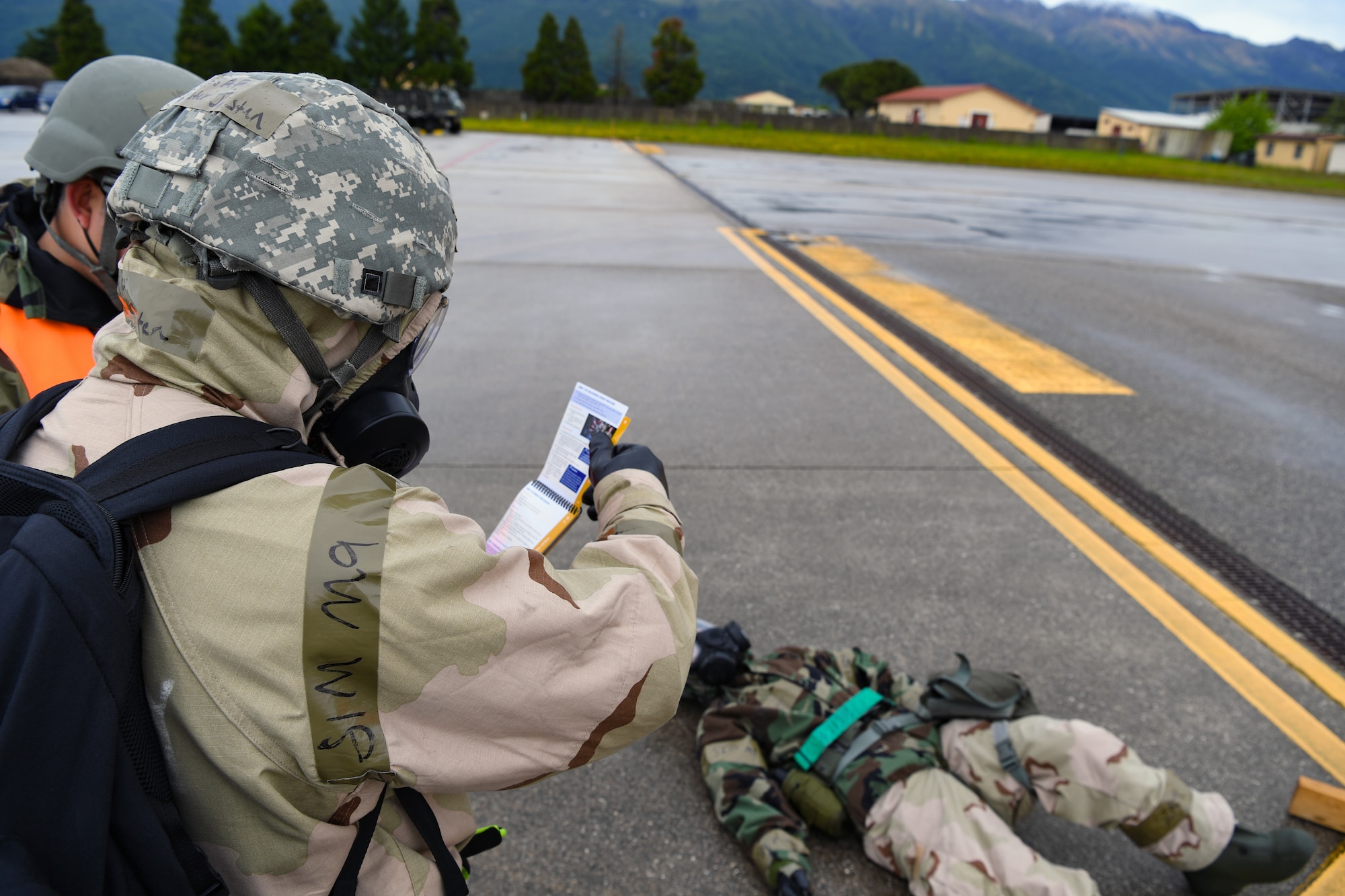 U.S. Airmen with the 724th Air Mobility Squadron participate in a Nodal Lightning exercise at Aviano Air Base, Italy, May 19, 2021. Nodal Lightning is a simulated air and chemical attack followed by other scenarios that test the teams Chemical, Biological, Radiological and Nuclear response. (U.S. Air Force photo by Airman 1st Class Thomas S. Keisler IV)