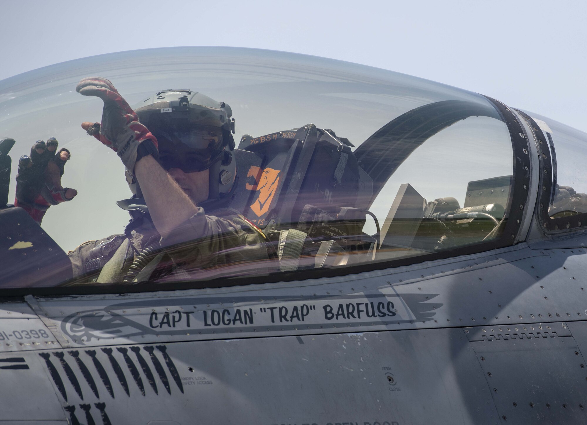 A photo of a pilot in the cockpit.