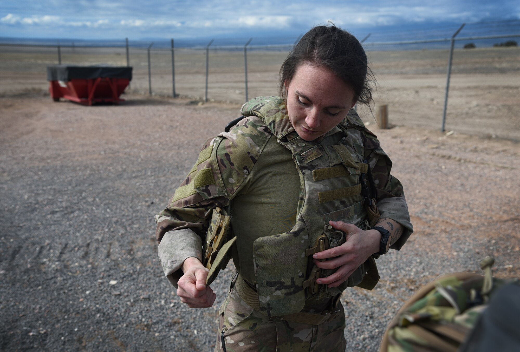 woman putting on gear