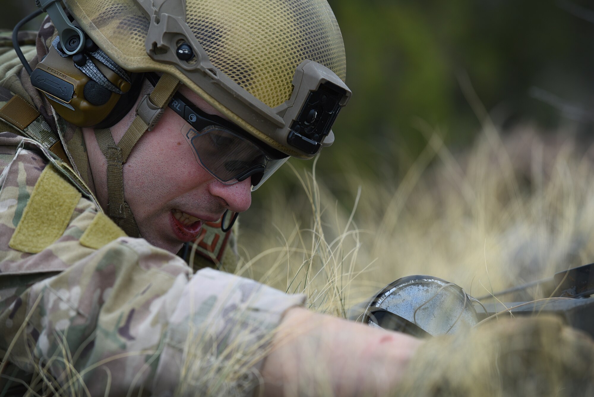 man working on unexploded ordinance