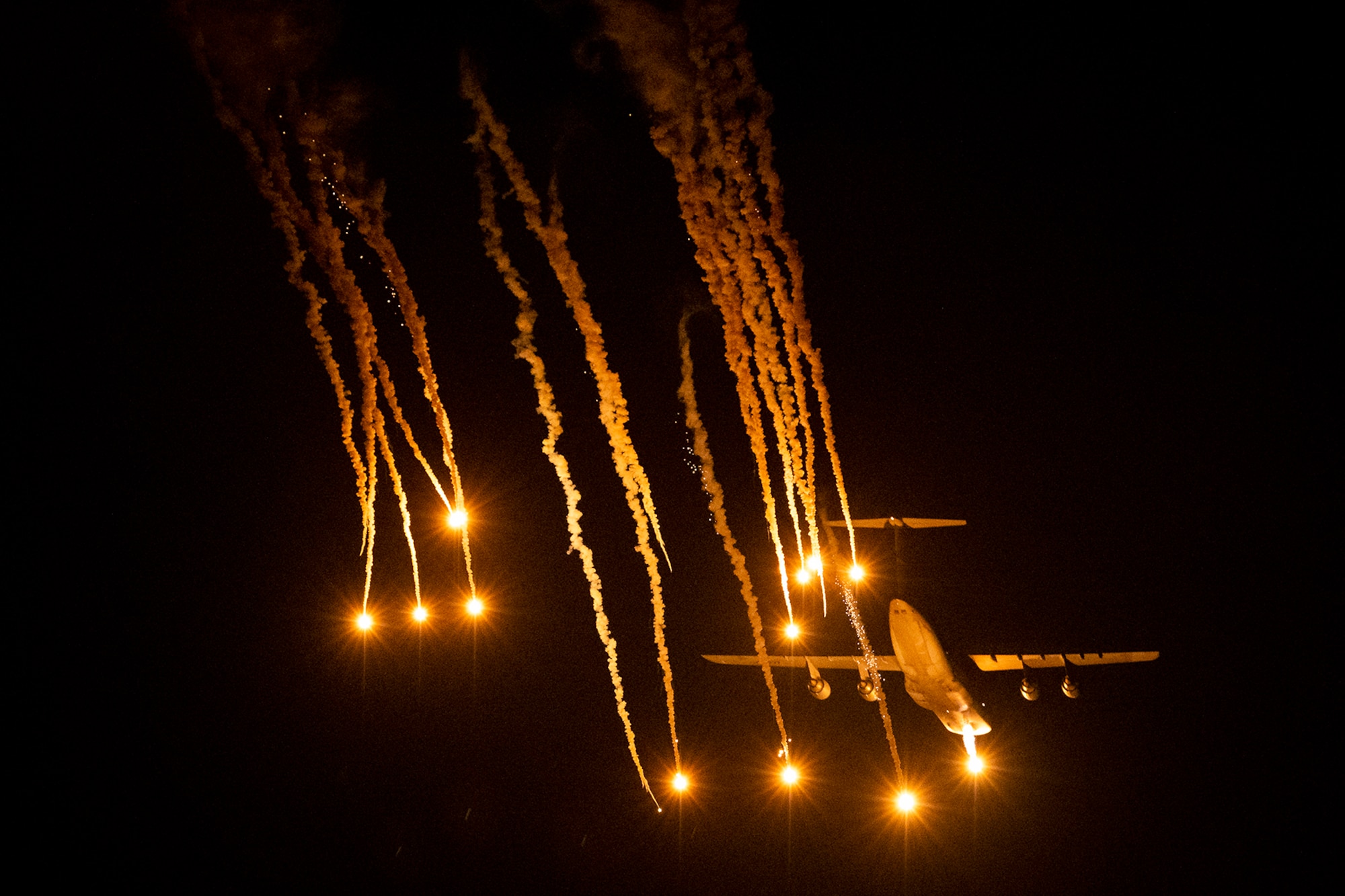 A 436th Airlift Wing C-5M Super Galaxy releases flares during a test May 12, 2021, at Eglin Air Force Base, Fla. The Dover AFB aircraft and aircrew released the flares as part of a two-week defensive countermeasures test program with the 46th Test Squadron.