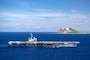 USS Ronald Reagan (CVN 76) steams off the coast of Iwo To.