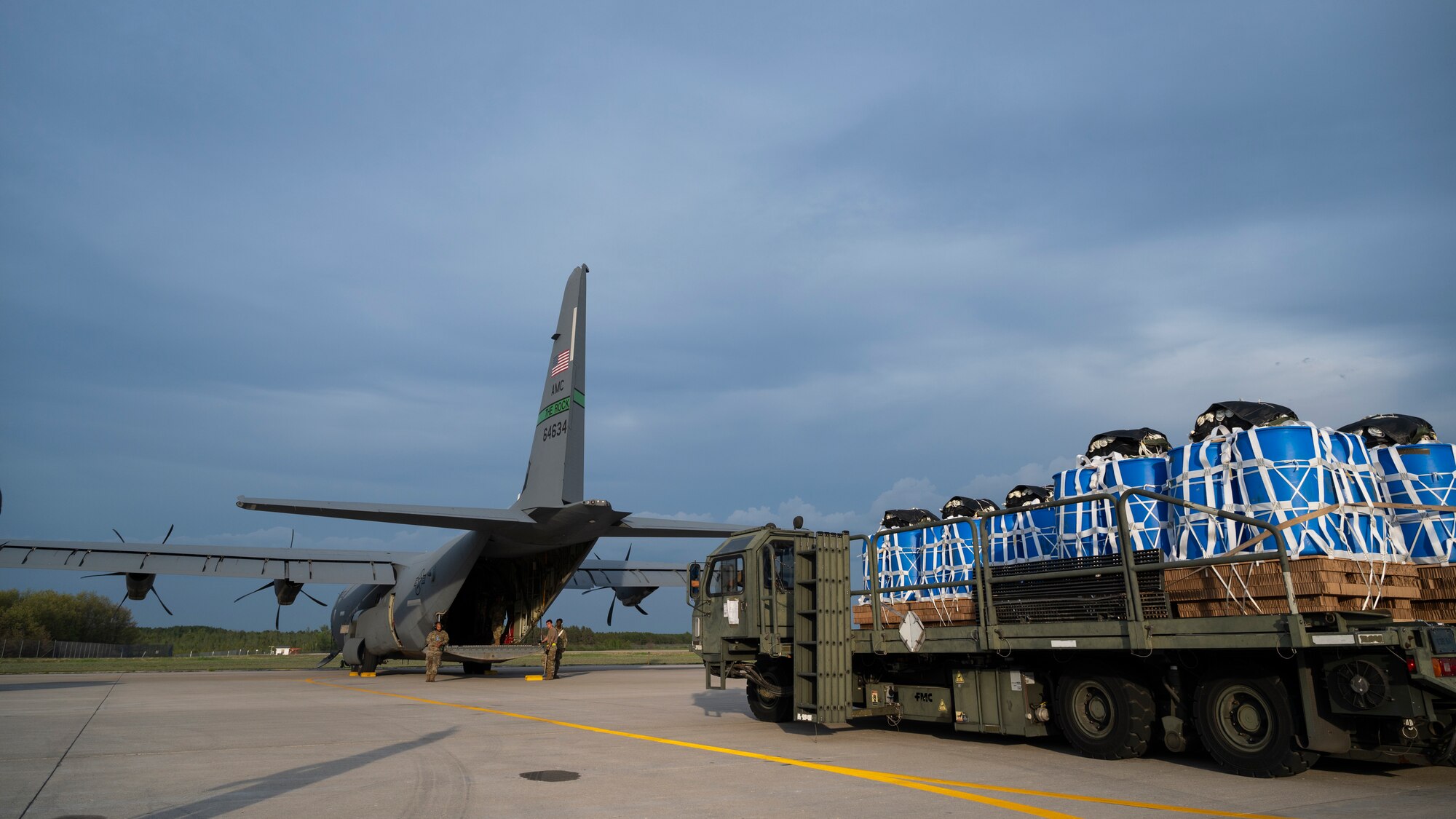 Airmen prepare to load container delivery systems