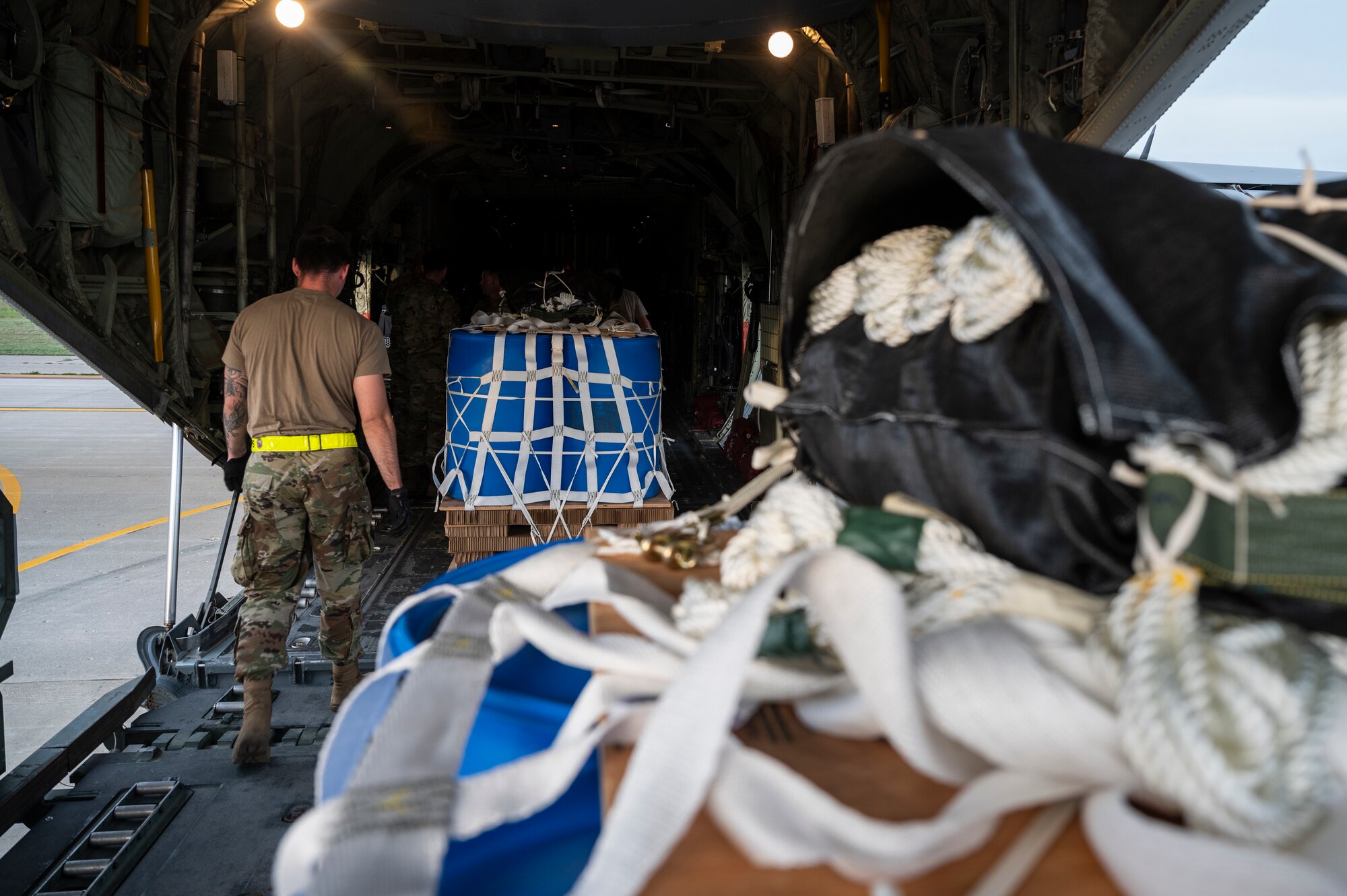 Airmen load a container delivery system