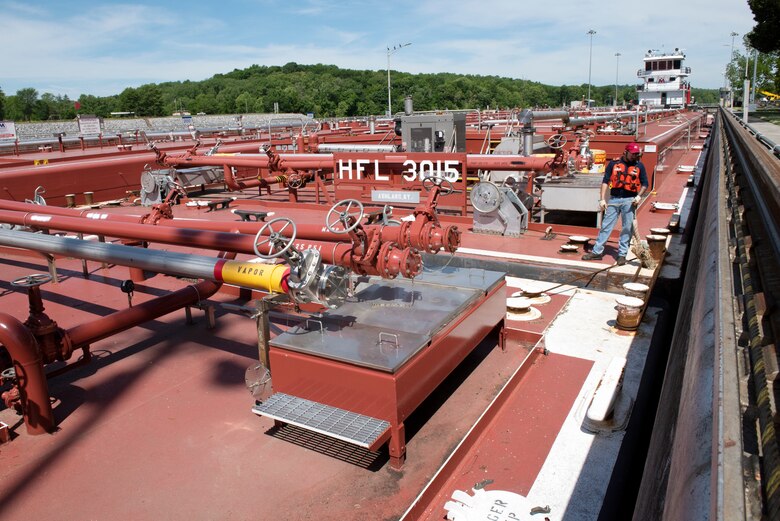 The Motor Vessel Tampa out of Ashland, Kentucky, moves Marathon Petroleum Company fuel barges May 21, 2021 through Cheatham Lock in Ashland City, Tennessee, headed to terminals in Nashville. The U.S. Army Corps of Engineers Nashville District worked with the fuel industry and Regional Rivers Repair Fleet, which is performing maintenance at the lock, to schedule openings to accommodate deliveries of fuel to Middle Tennessee. Each barge carries around 28,000 barrels of fuel. (USACE Photo by Lee Roberts)