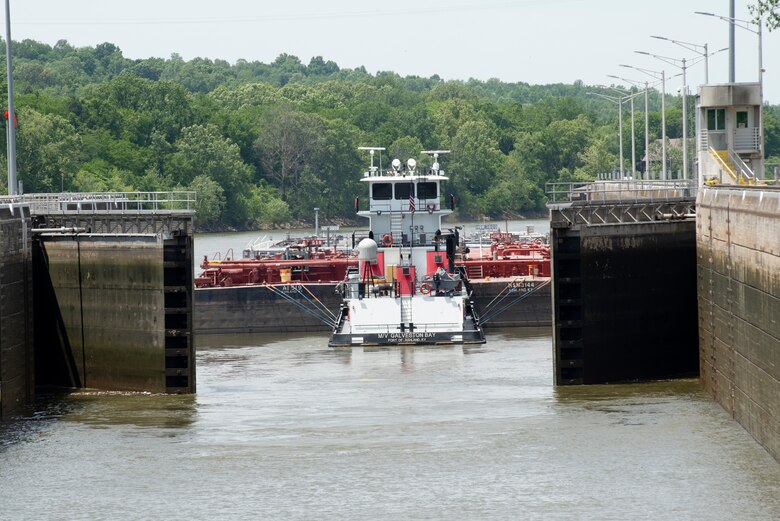 The Motor Vessel Galveston Bay out of Ashland, Kentucky, with empty Marathon Petroleum Company fuel barges, exits Cheatham Lock in Ashland City, Tennessee, May 21, 2021 headed downstream back to refineries in Texas. The U.S. Army Corps of Engineers Nashville District worked with the fuel industry and Regional Rivers Repair Fleet, which is performing maintenance at the lock, to schedule openings to accommodate the movement of fuel barges on the Cumberland River. (USACE Photo by Lee Roberts)