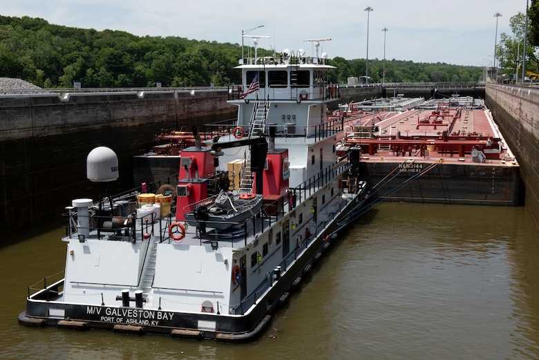 The Motor Vessel Galveston Bay out of Ashland, Kentucky, moves empty Marathon Petroleum Company fuel barges May 21, 2021 through Cheatham Lock in Ashland City, Tennessee, headed downstream back to refineries in Texas. The U.S. Army Corps of Engineers Nashville District worked with the fuel industry and Regional Rivers Repair Fleet, which is performing maintenance at the lock, to schedule openings to accommodate the movement of fuel barges on the Cumberland River. (USACE Photo by Lee Roberts)