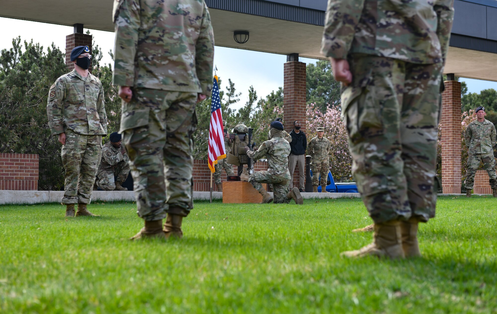 People standing and person kneeling