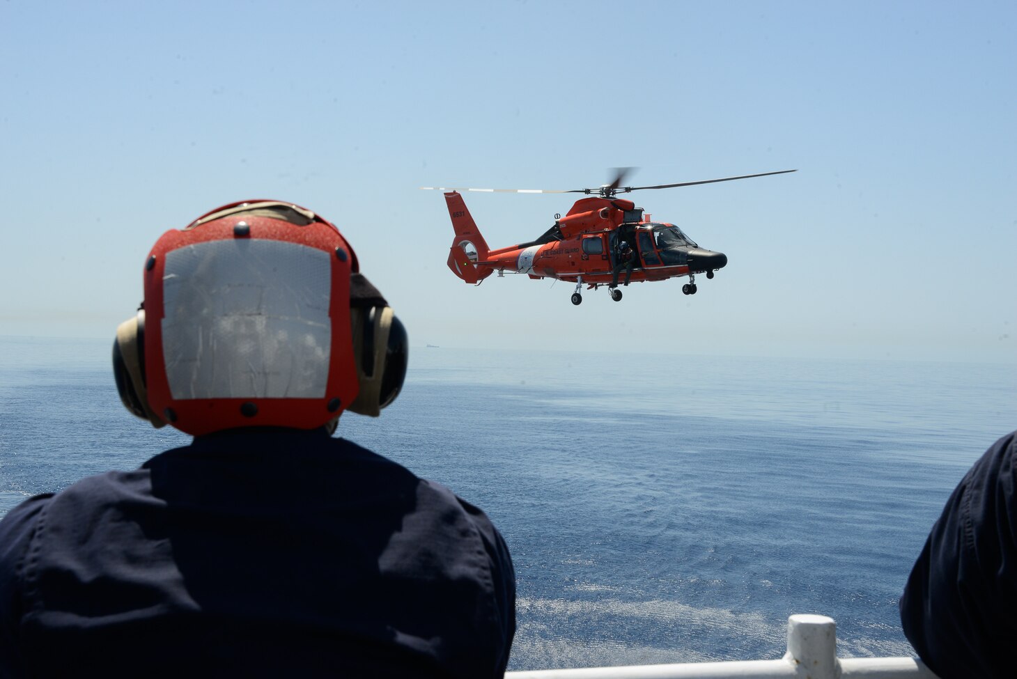 210517-G-ID129-1211 MEDITERRANEAN SEA (May 17, 2021) Members from the Armed Forces of Malta observe how the Coast Guard conducts helicopter operations aboard the Legend-class cutter USCGC Hamilton (WMSL 753), May 17, 2021. Hamilton is on a routine deployment in the U.S. Sixth Fleet area of operations in support of U.S. national interests and security in Europe and Africa. (U.S. Coast Guard photo by Petty Officer 3rd Class Sydney Phoenix)