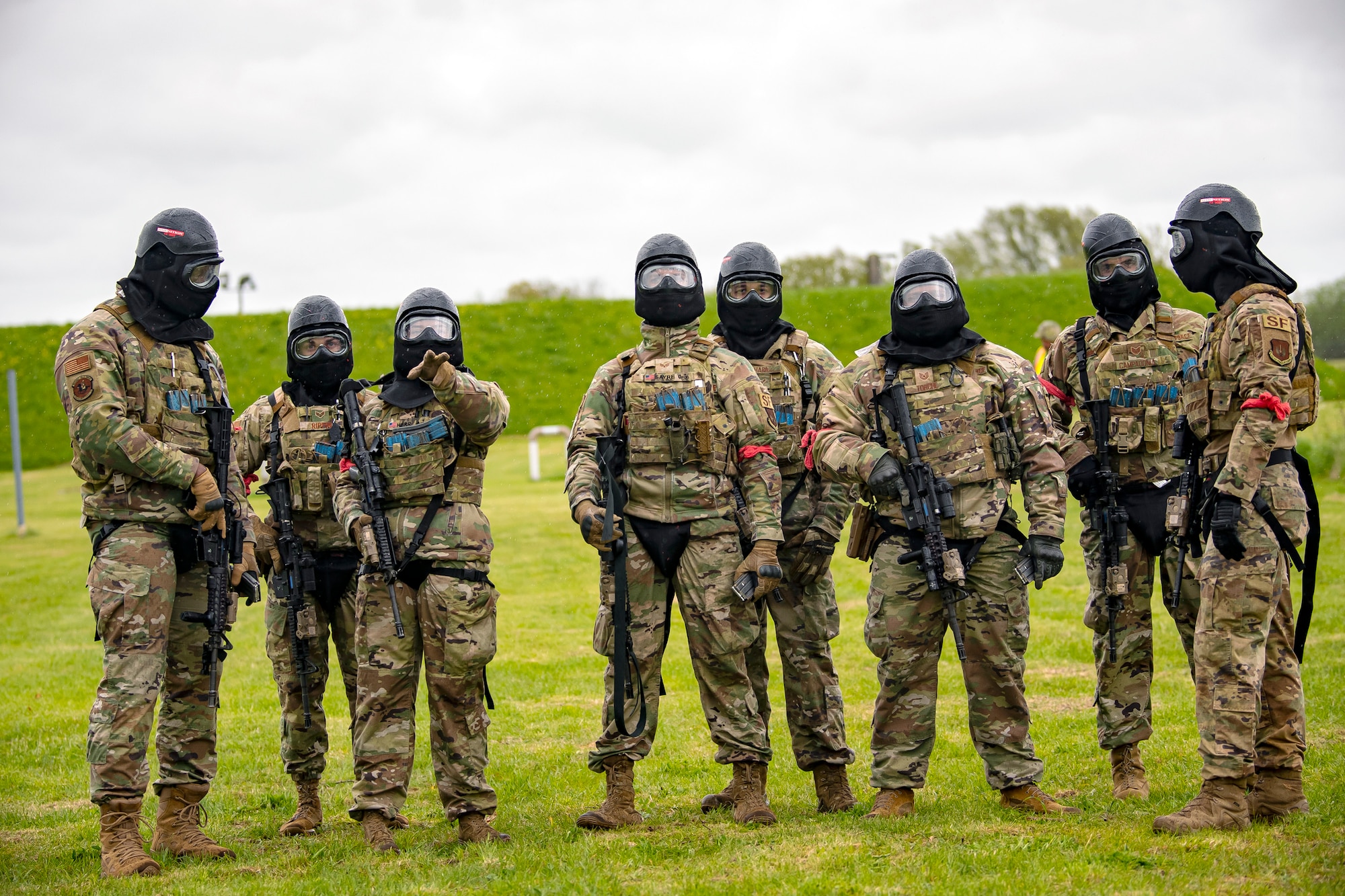 Airmen from the 422d Security Forces Squadron, discuss strategy prior to a Force-on-Force exercise at RAF Molesworth, England, May 21, 2021. Defenders from the 422d and 423rd SFS came together to sharpen their shoot, move, communicate tactics as they responded to multiple scenarios geared towards sharpening their skills in deadly force situations. (U.S. Air Force photo by Senior Airman Eugene Oliver)