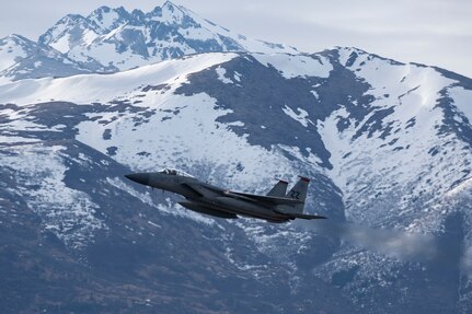 A U.S. Air Force F-15C Eagle assigned to the 18th Wing out of Kadena Air Base, Okinawa, Japan, takes off at Joint Base Elmendorf-Richardson, Alaska, May 11, 2021, during Northern Edge 21. NE21 is one in a series of U.S. Indo-Pacific Command exercises designed to sharpen the joint forces' skills, practice tactics, techniques, and procedures, improve command, control, and communication relationships develop cooperative plans and programs.