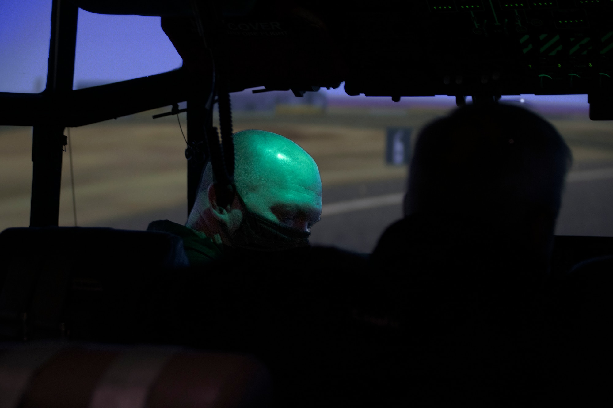 Air National Guard Lt. Col. Rob Gearhart, a pilot from the 143d Airlift Wing, trains with an instructor during the first class of Weapons Systems Trainer-Reconfigurable, at Quonset Air National Guard Base, North Kingstown, R.I., May 7, 2021. The WST10R flight simulator adds the capability for instructors to offer more training in lieu of things like inclement weather. (U.S. Air National Guard photo by Airman 1st Class Brittni Capozzi)