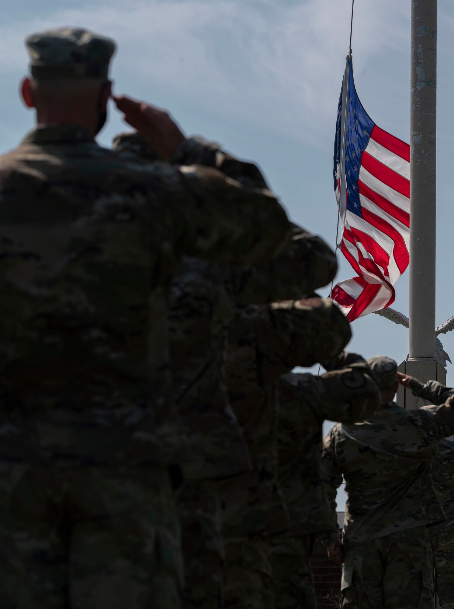 The Team Dover Chief’s Group and First Sgt. Council salute the flag during a retreat ceremony at Dover Air Force Base, Delaware, May 20, 2021. Retreat is used to pay respects to the flag and signifies the end of the duty day. (U.S. Air Force photo by Airman 1st Class Cydney Lee)