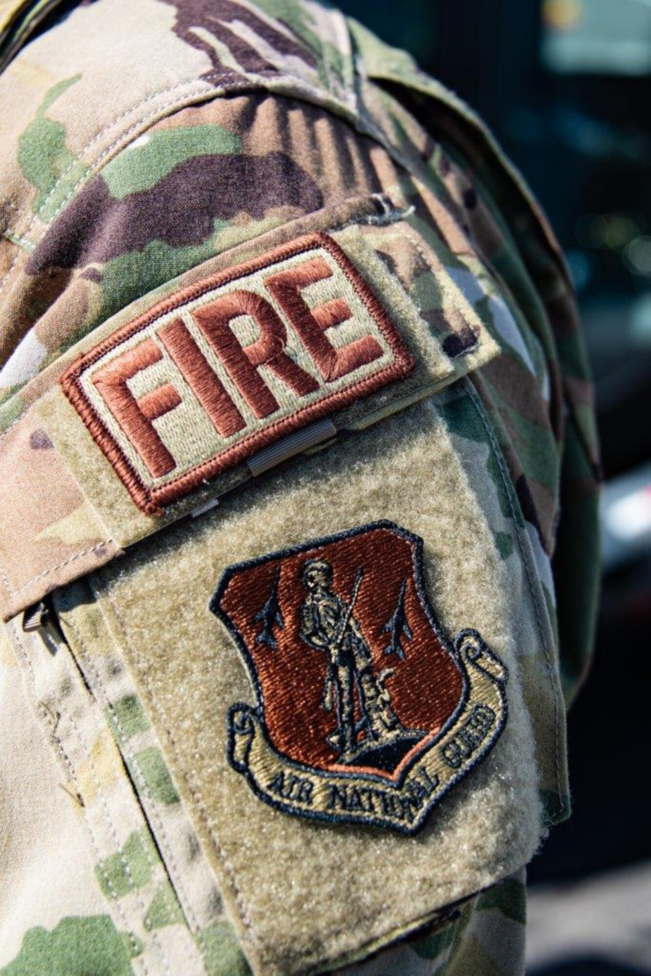 NEW CASTLE AIR NATIONAL GUARD BASE, Del.— Staff Sgt. Alfred Akeroyd a firefighter with the 166th Civil Engineer Squadron displays his wing patch, 12-May-2020. Staff Sgt. Akeroyd deployed to the Baghdad, Iraq air base to train Iraqi firefighters from November 2019 through April 2020. During his deployment, Akeroyd endured numerous rocket and mortar attacks from rebel extremists while working as an air advisor to the Iraqi military. (U.S. Air National Guard photo by Mr. Mitch Topal)