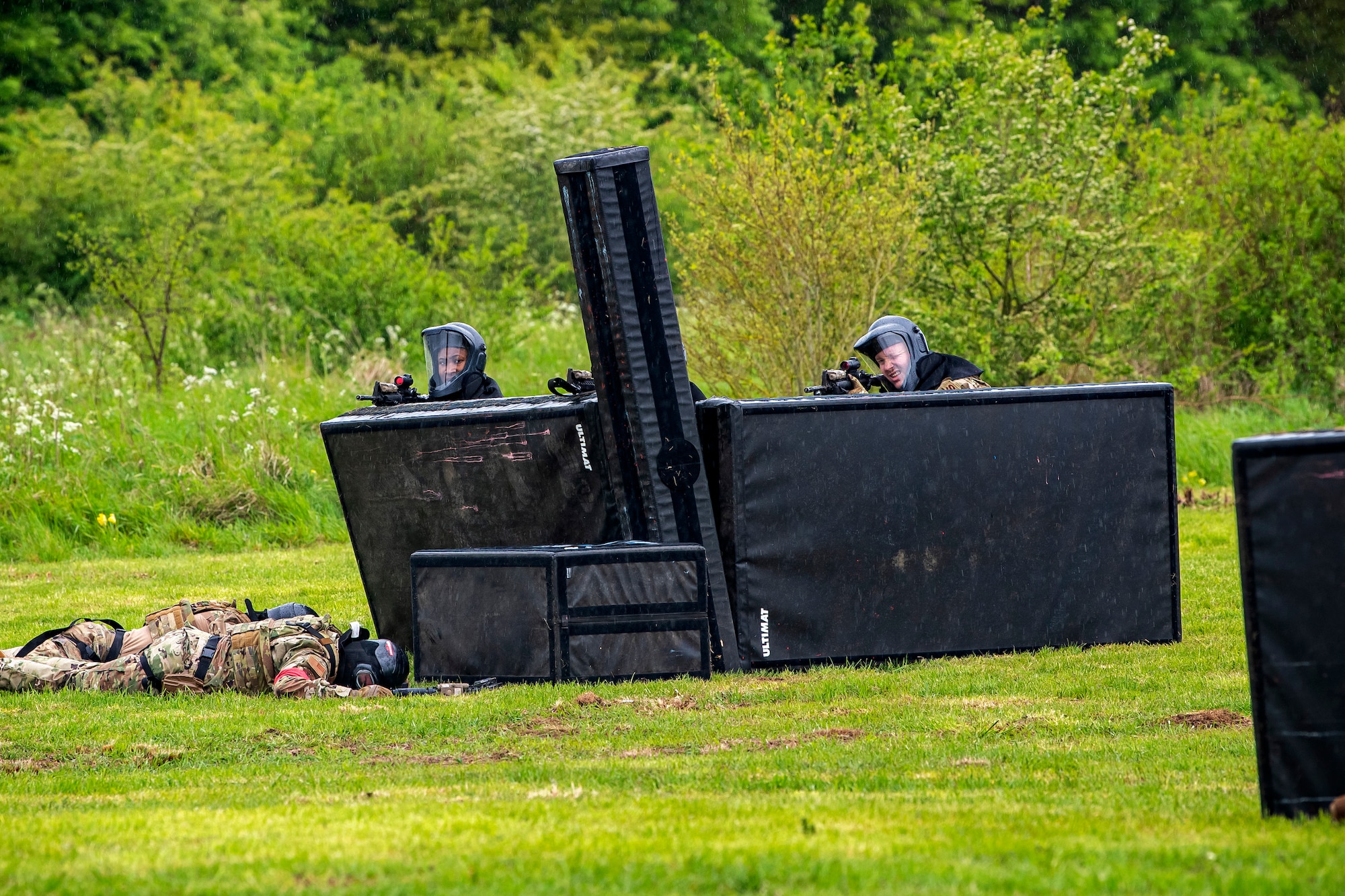 Airmen from the 423rd Security Forces Squadron, defend their position during a Force-on-Force exercise at RAF Molesworth, England, May 21, 2021. Defenders from the 422d and 423rd SFS came together to sharpen their shoot, move, communicate tactics as they responded to multiple scenarios geared towards sharpening their skills in deadly force situations. (U.S. Air Force photo by Senior Airman Eugene Oliver)