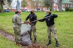 Petty Officers Francheska Keith, Astrid Santiago and Christian Woods participate in the Second Class Petty Officer Association (SCPOA) cleanup efforts by bagging leaves in Norfolk Naval Shipyard’s (NNSY’s) historic Trophy Park.  These efforts are the first of several landscape restoration and cleanup projects in NNSY’s historic Trophy Park.