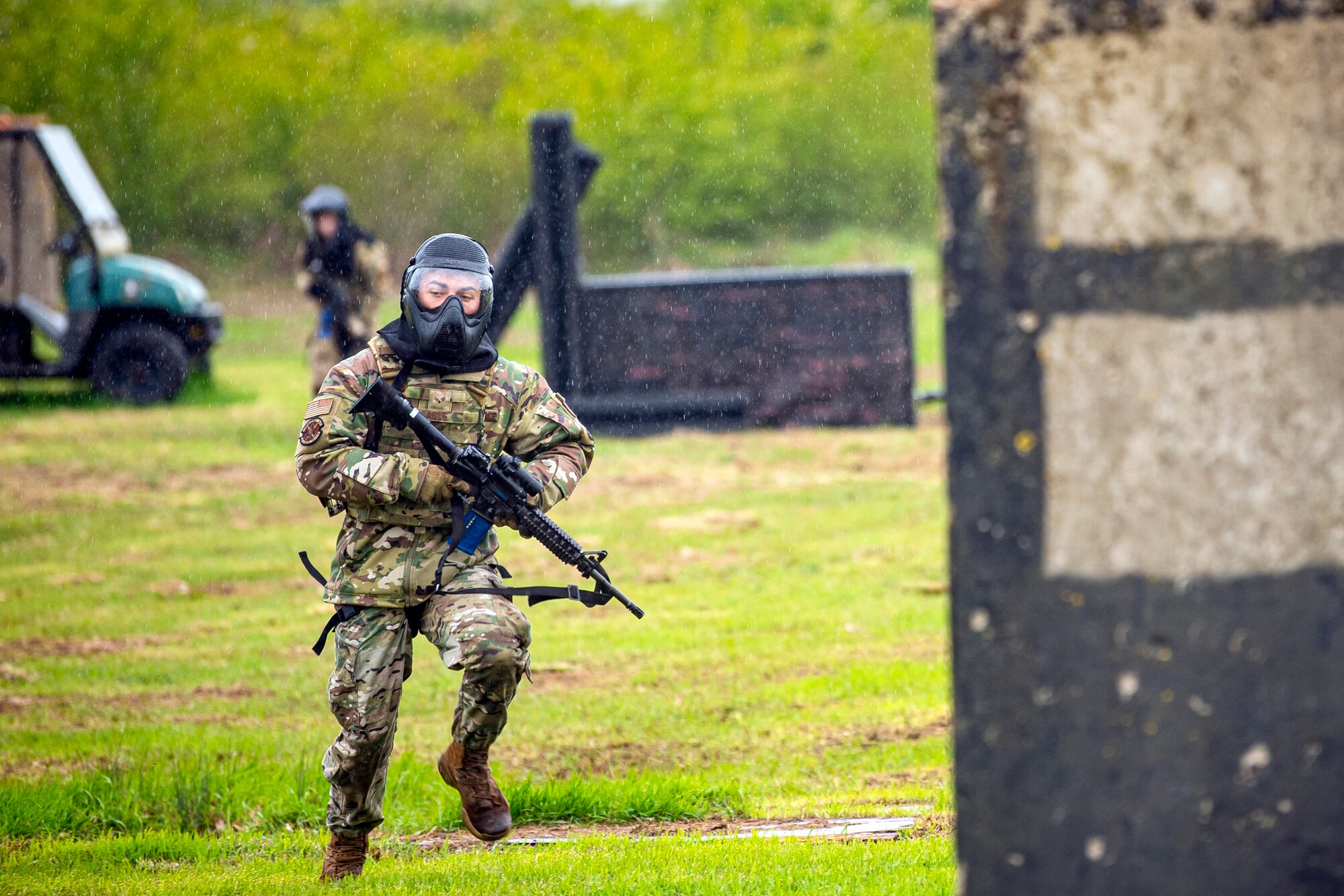 U.S. Air Force Senior Airman Joshua Able, 422d Security Forces Squadron response force leader, advances his position during a Force on Force exercise at RAF Molesworth, England, May 21, 2021. Defenders from the 422d and 423rd SFS came together to sharpen their shoot, move, communicate tactics as they responded to multiple scenarios geared towards sharpening their skills in deadly force situations. (U.S. Air Force photo by Senior Airman Eugene Oliver)