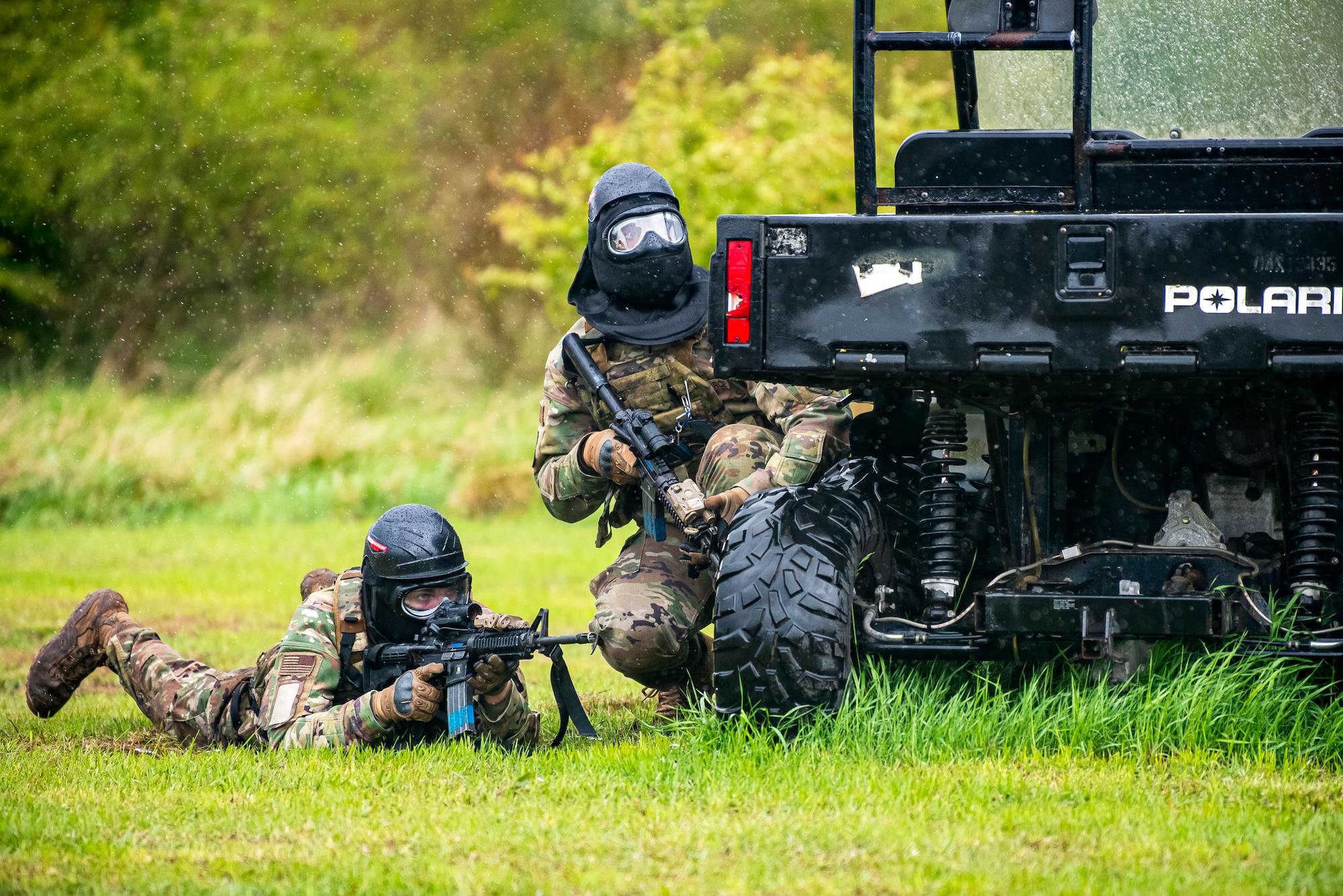 Airmen from the 423rd Security Forces Squadron scan their perimeter during a Force-on- Force exercise at RAF Molesworth, England, May 21, 2021. Defenders from the 422d and 423rd SFS came together to sharpen their shoot, move, communicate tactics as they responded to multiple scenarios geared towards sharpening their skills in deadly force situations. (U.S. Air Force photo by Senior Airman Eugene Oliver)