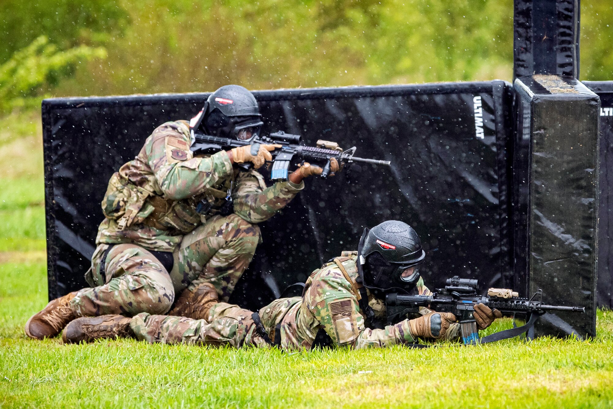 Airmen from the 423rd Security Forces Squadron, defend their position during a Force-on-Force exercise at RAF Molesworth, England, May 21, 2021.  Defenders from the 422d and 423rd SFS came together to sharpen their shoot, move, communicate tactics as they responded to multiple scenarios geared towards sharpening their skills in deadly force situations. (U.S. Air Force photo by Senior Airman Eugene Oliver)