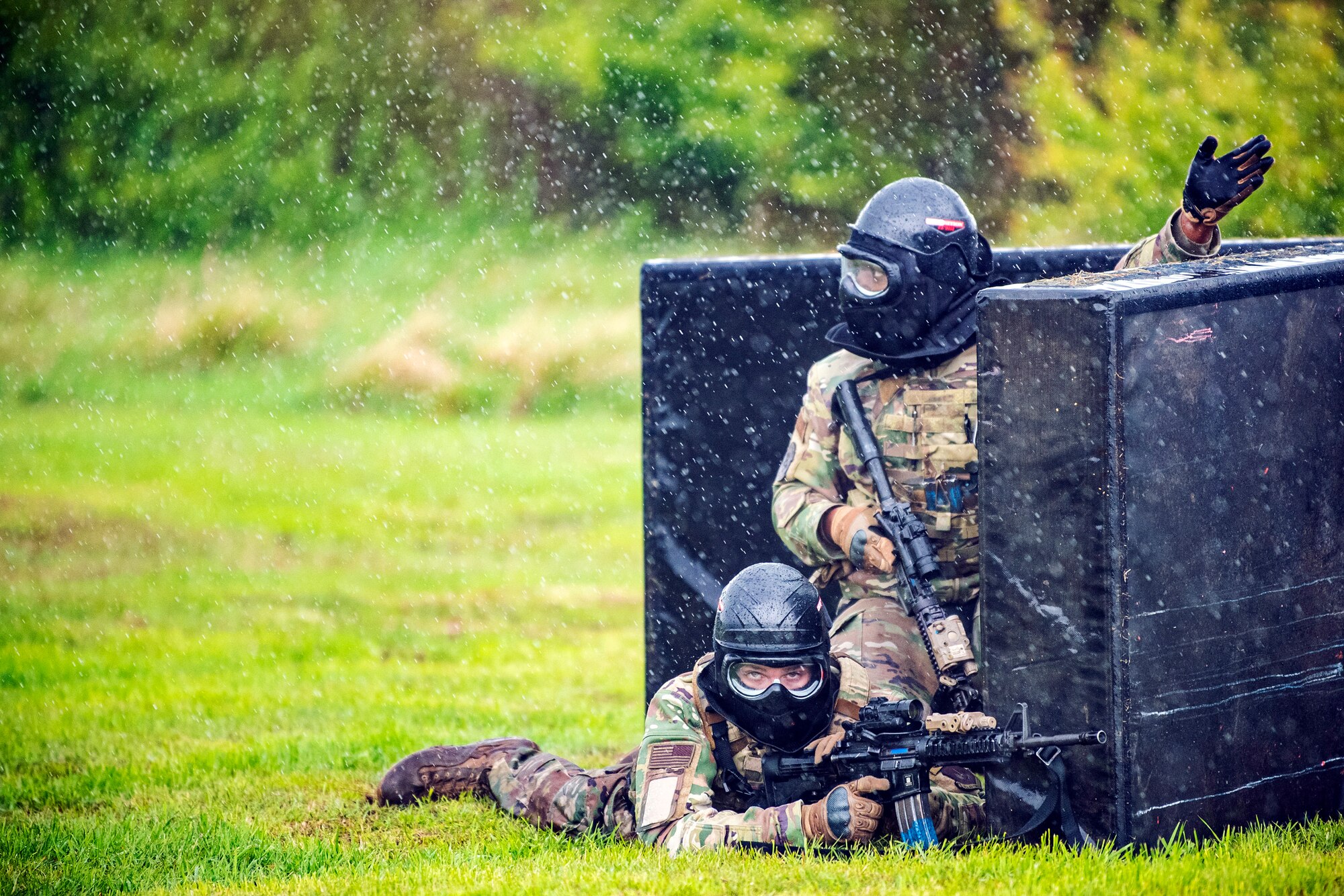 Airmen from the 423rd Security Forces Squadron scan their perimeter during a Force-on- Force exercise at RAF Molesworth, England, May 21, 2021. Defenders from the 422d and 423rd SFS came together to sharpen their shoot, move, communicate tactics as they responded to multiple scenarios geared towards sharpening their skills in deadly force situations. (U.S. Air Force photo by Senior Airman Eugene Oliver)