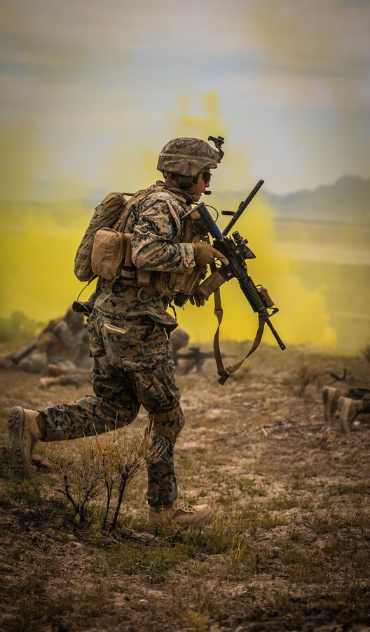 Sgt. Daniel Helms, a rifleman with Fox Company, 2nd Battalion, 23rd Marine Regiment, advances during a platoon live-fire attack at Dugway Proving Grounds, Utah, on May 15, 2021. This training allows Marines to progress from previous training exercises and continue to prepare for Integrated Training Exercise 4-21. (U.S. Marine Corps photo by Lance Cpl. Samwel Tabancay)