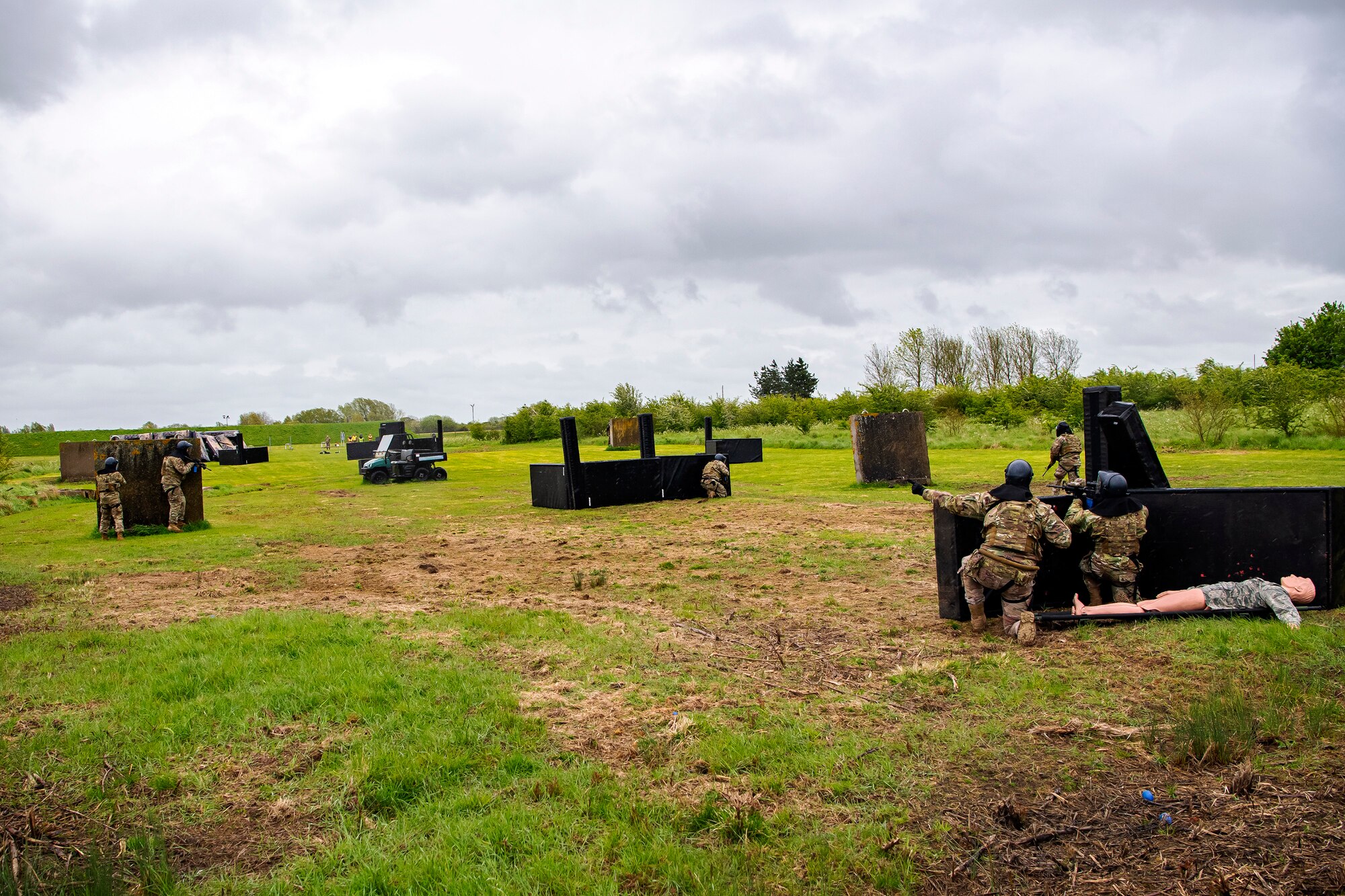 Airmen from the 423rd Security Forces Squadron prepare to advance their position during a Force-on-Force exercise at RAF Molesworth, England, May 21, 2021.  Defenders from the 422d and 423rd SFS came together to sharpen their shoot, move, communicate tactics as they responded to multiple scenarios geared towards sharpening their skills in deadly force situations. (U.S. Air Force photo by Senior Airman Eugene Oliver)