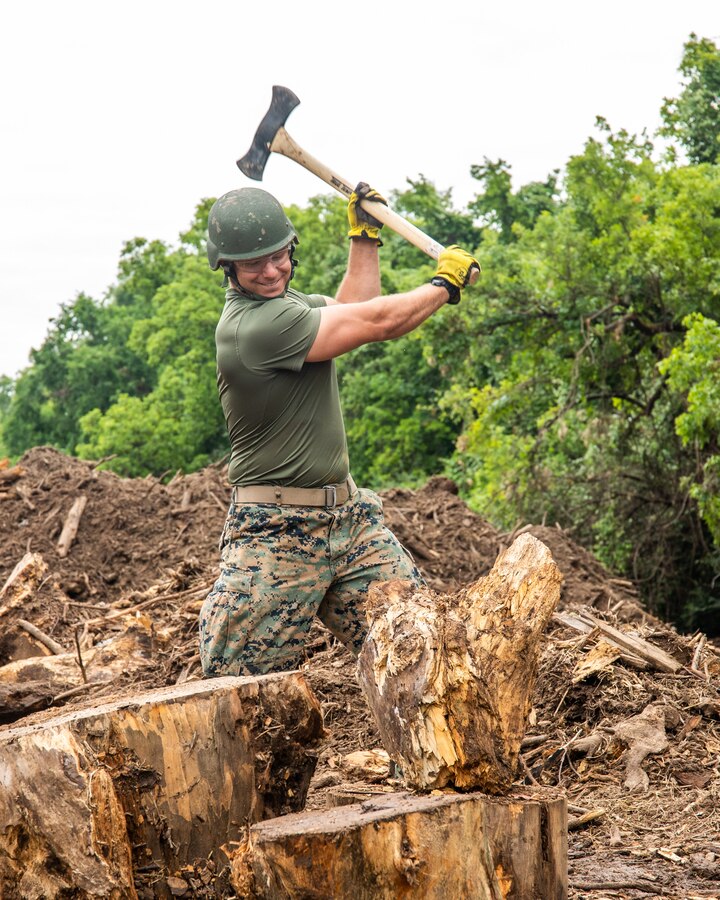Lance Cpl. Colby Davendonis, a bulk fuel specialist with 6th Engineering Support Battalion, 4th Marine Logistics Group, clears foliage at Camp Carter, Fort Worth, Texas on May 14, 2021. The Camp Carter project is an Innovative Readiness Training (IRT) led by the Marine Corps, in partnership with the YMCA, which provides Marines the opportunity to train in a joint environment while building civil-military partnerships. (U.S. Marine Corps photo by Lance Cpl. David Intriago)