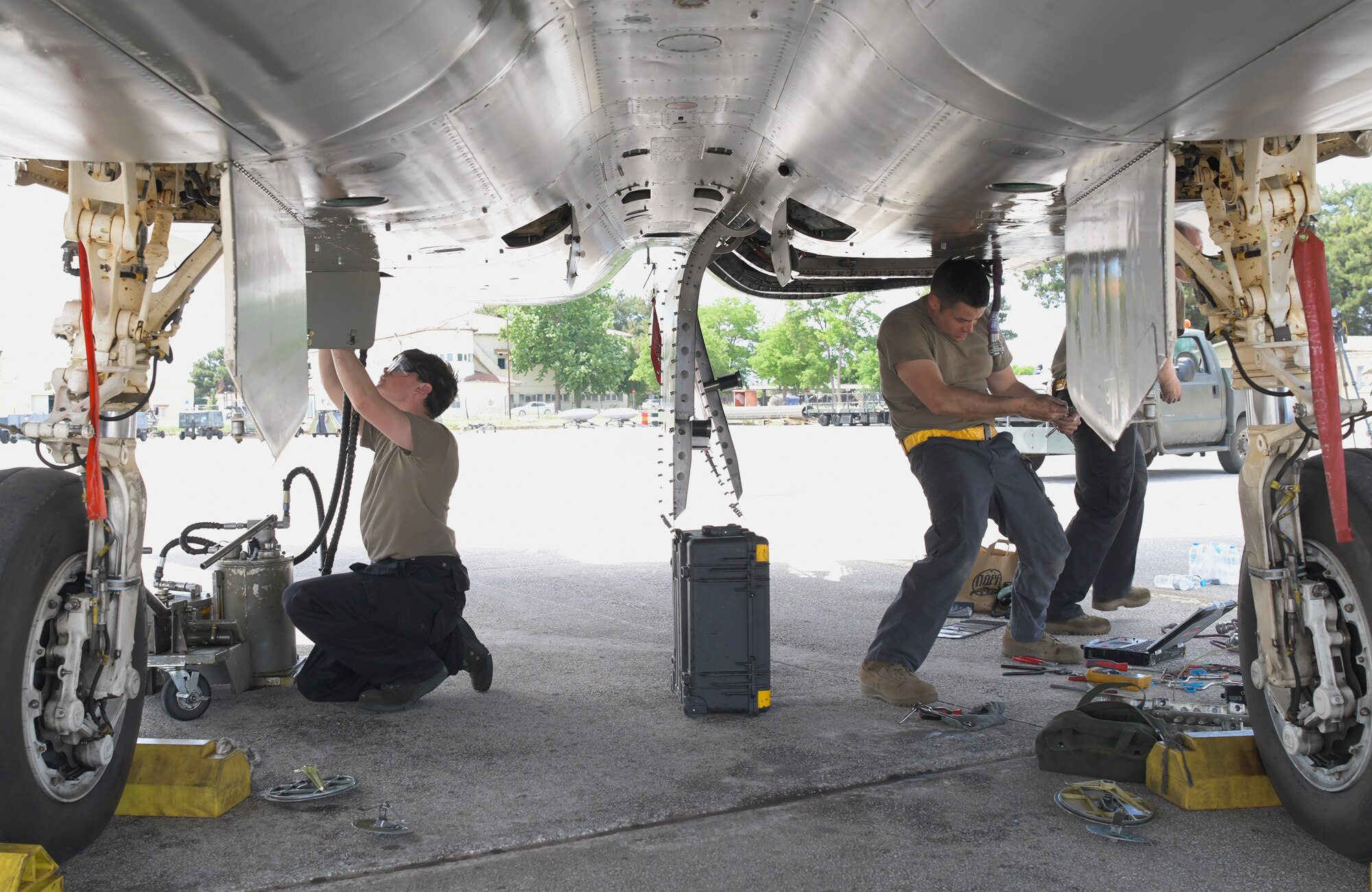 U.S. Air Force Staff Sgt Hunter Andrus, 748th Aircraft Maintenance Squadron crew chief, and Tech. Sgt . Shawn Davis, 748th AMXS engines NCO in-charge, replaces an engine cable on an F-15C Eagle assigned to the 493rd Fighter Squadron during exercise Astral Knight 21 at Larissa Air Base, Greece, May 20, 2021. During Astral Knight 21, the Liberty Wing sharpened its ability to deploy capable, credible forces to operate from strategic locations, which is enabled by strong regional partnerships critical for a rapid united response to adversaries around the world. (U.S. Air Force photo by Tech. Sgt. Alex Fox Echols III)