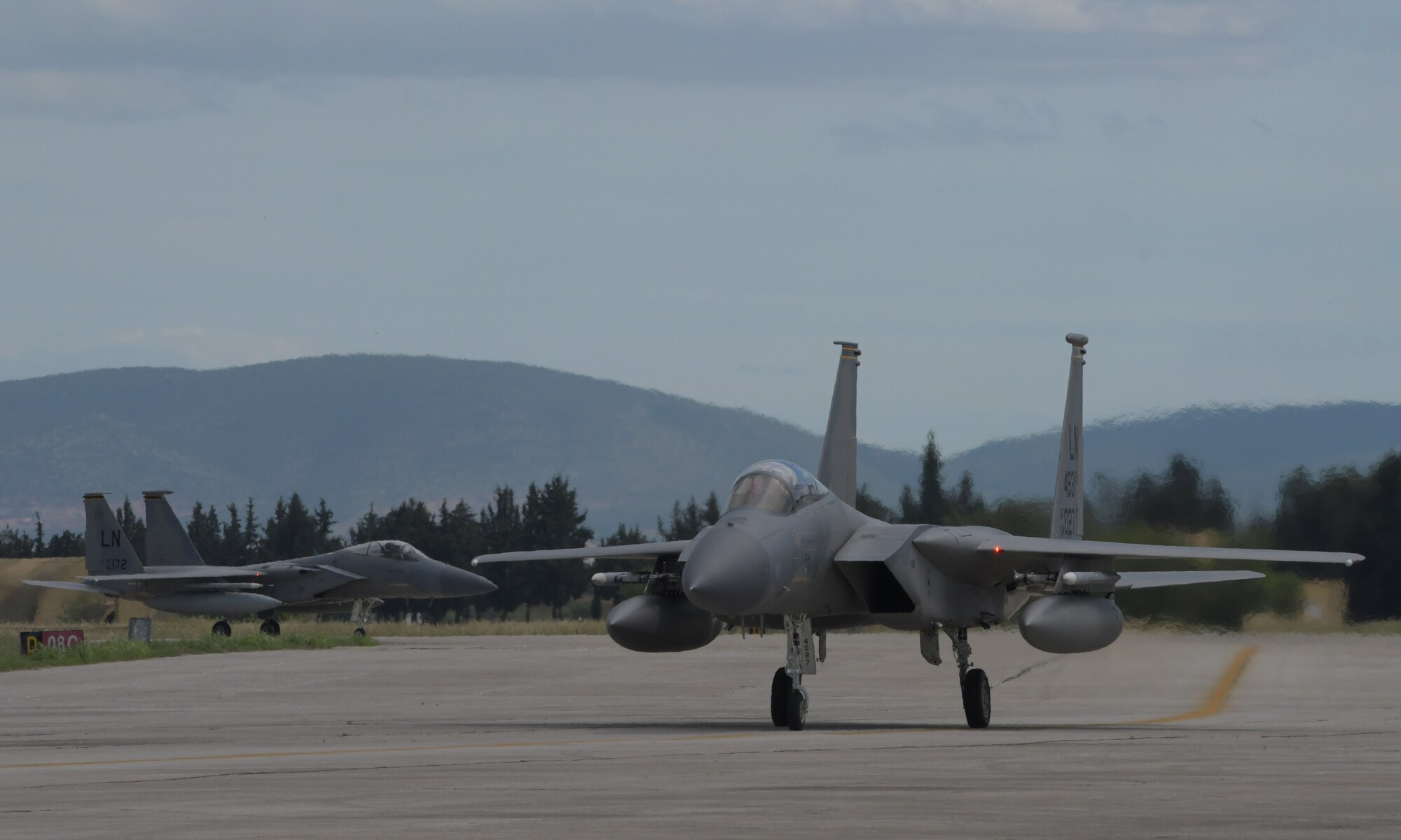 Two U.S. Air Force F-15C Eagles assigned to the 493th Fighter Squadron taxi after a sortie during exercise Astral Knight 21 at Larissa Air Base, Greece, May 20, 2021. The 48th Fighter Wing trained with military forces from Albania, Croatia, Greece, Italy, and Slovenia as well as U.S. units from around European Command enhancing the readiness, strength and cohesion of these alliances. (U.S. Air Force photo by Tech. Sgt. Alex Fox Echols III)