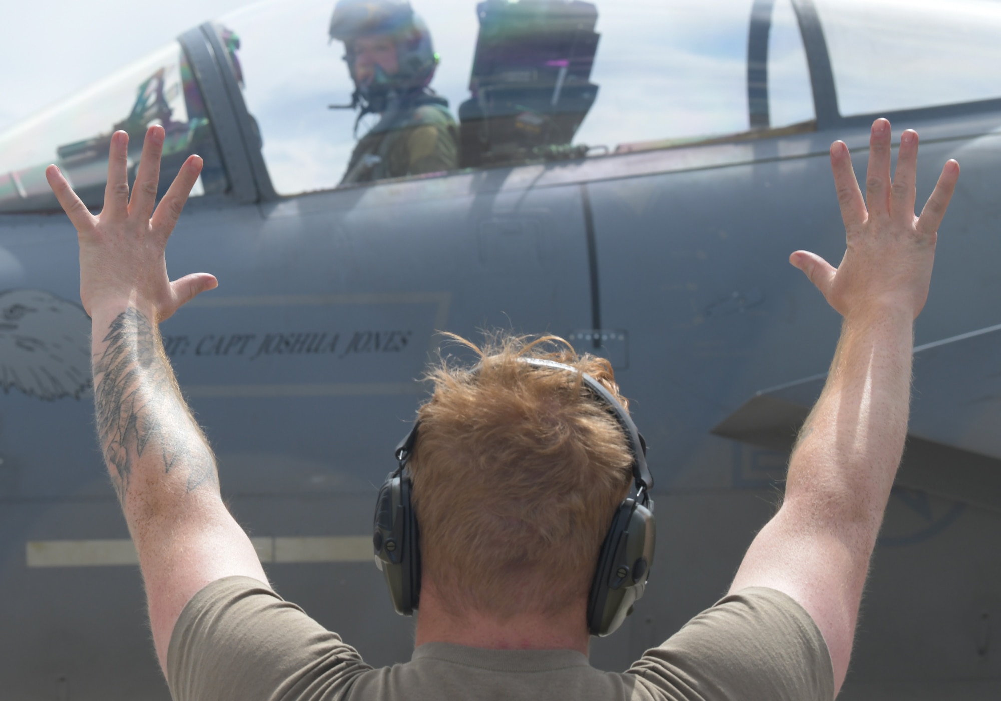 U.S. Air Force Senior Airman Brian Jankowski, 748th Aircraft Maintenance Squadron crew chief, marshals an F-15C Eagle assigned to the 493rd Fighter Squadron during exercise Astral Knight 21 at Larissa Air Base, Greece, May 20, 2021. The 48th Fighter Wing deployed 12 F-15C/D Eagles and more than 250 Airmen from the 493rd FS, 748th AMXS and other supporting units to participate in the exercise. (U.S. Air Force photo by Tech. Sgt. Alex Fox Echols III)