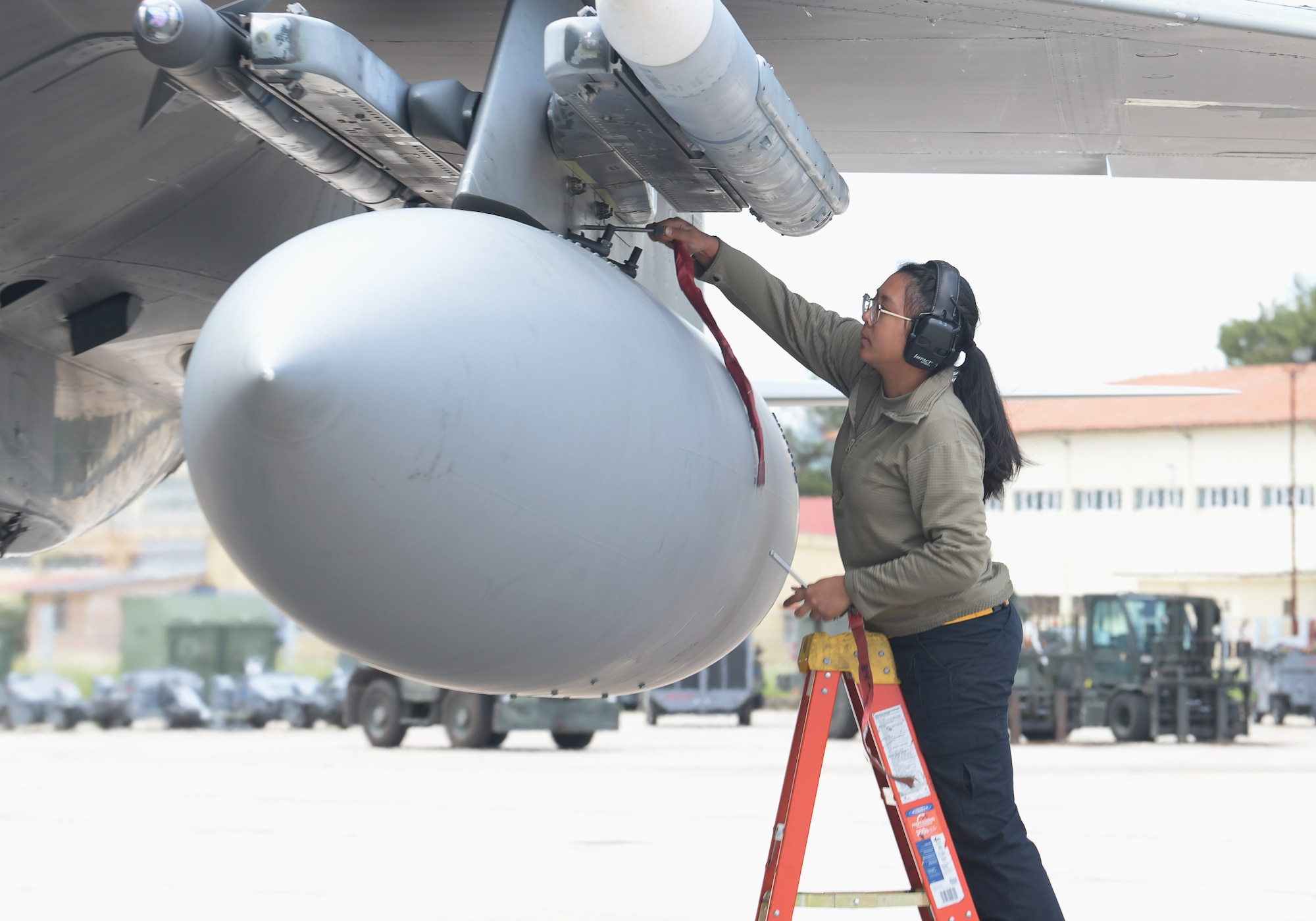 U.S. Air Force Airman 1st Class Amy Phanthavong, 493rd Aircraft Maintenance Squadron weapons load crew member, disarms munitions on an F-15C Eagle assigned to the 493rd Fighter Squadron during exercise Astral Knight 21 at Larissa Air Base, Greece, May 20, 2021. Astral Knight is a multinational, integrated air and missile defense exercise conducted in the Adriatic Region of Europe designed to enhance interoperability between the U.S. and its NATO allies in the region. (U.S. Air Force photo by Tech. Sgt. Alex Fox Echols III)