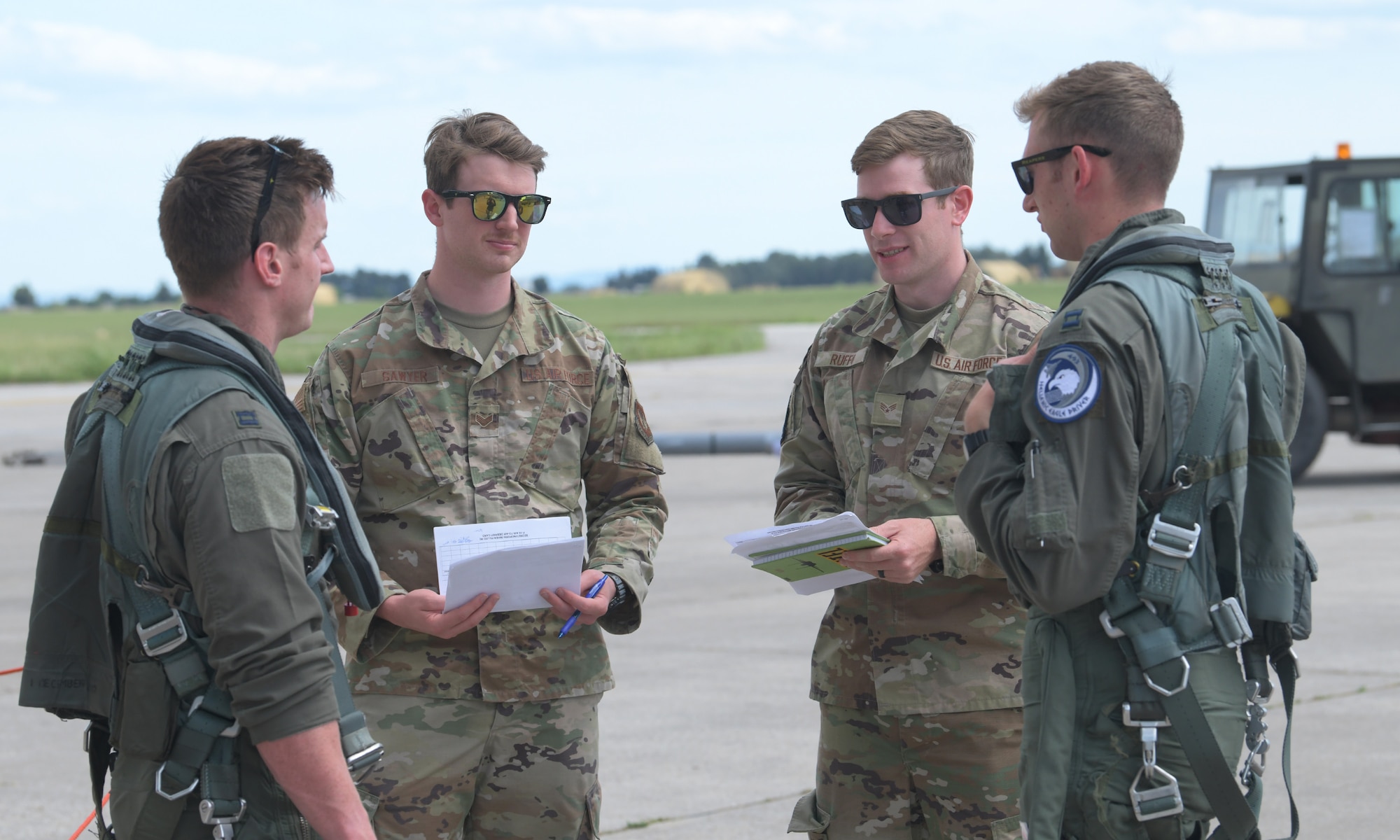 U.S. Air Force Senior Airmen Robert Sawyer (second from left) and Aaron Ruffo (third from left), 493rd Fighter Squadron intel analysts, debrief to pilots assigned to the 493rd Fighter Squadron during exercise Astral Knight 21 at Larissa Air Base, Greece, May 20, 2021. Astral Knight is a multinational, integrated air and missile defense exercise conducted in the Adriatic Region of Europe designed to enhance interoperability between the U.S. and its NATO allies in the region. (U.S. Air Force photo by Tech. Sgt. Alex Fox Echols III)