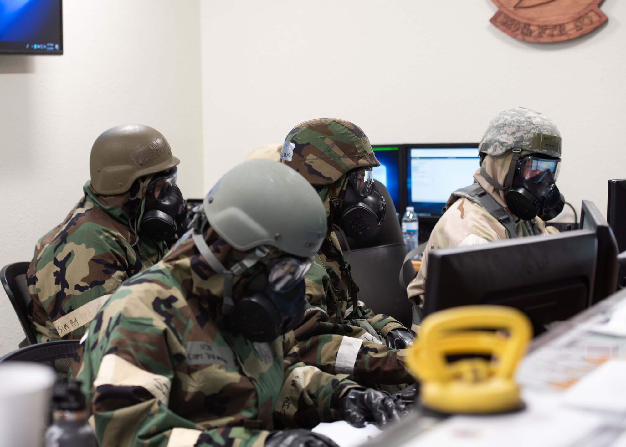 389th Airmen are maintaining and directing flight operations in Mission-Oriented Personal Protective gear.