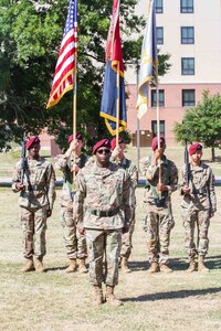 Lt. Col. Adrian Plater, 82nd Finance Battalion commander, stands in front of a color guard during the unit's re-activation ceremony at Fort Bragg, North Carolina, May 20, 2021. (U.S. Army photo by Spc. Gerald Holman)