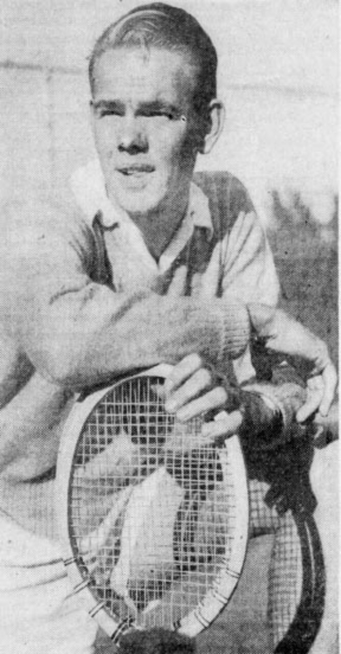 A tennis player poses for a photo.