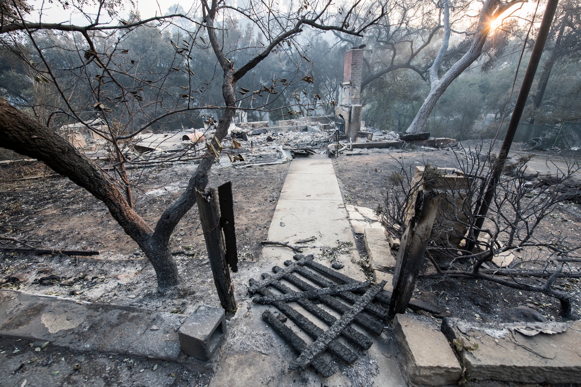 A chimney is all that stands of a home burned by the Thomas Fire. The fire started on Dec. 4, 2017 in Santa Paula, near Thomas Aquinas College. Driven by Santa Ana winds gusting up to 70 mph, the flames screamed across the hillsides toward Ojai, Ventura and Santa Barbara. The 146 Airlift Wing was activated Dec.5, 2017, to support CAL FIRE with wildfire suppression efforts within the state. (U.S. Air Force photo/Master Sgt. Brian Ferguson)