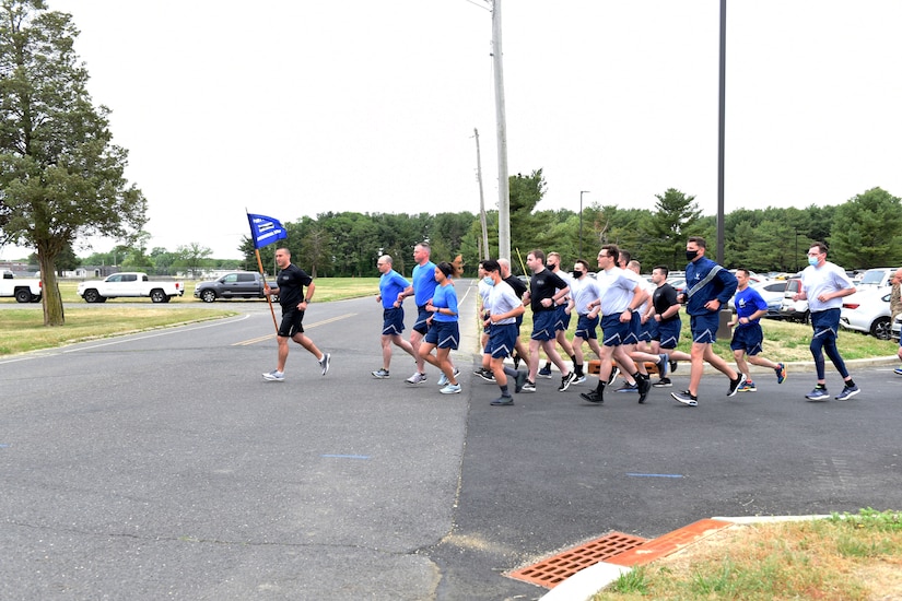 Airmen run during a memorial event.