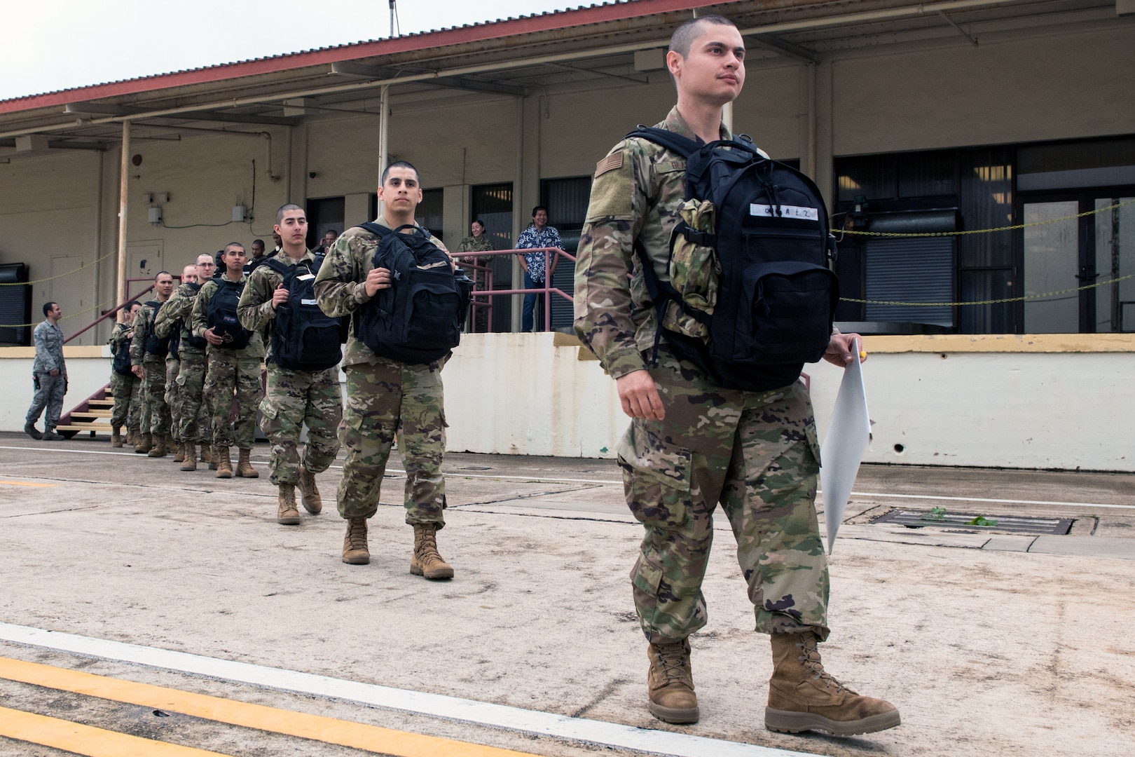 Airmen load a commercial aircraft.