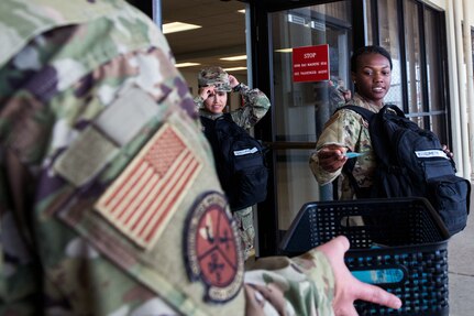 Female Airman prepares to load a commercial aircraft.